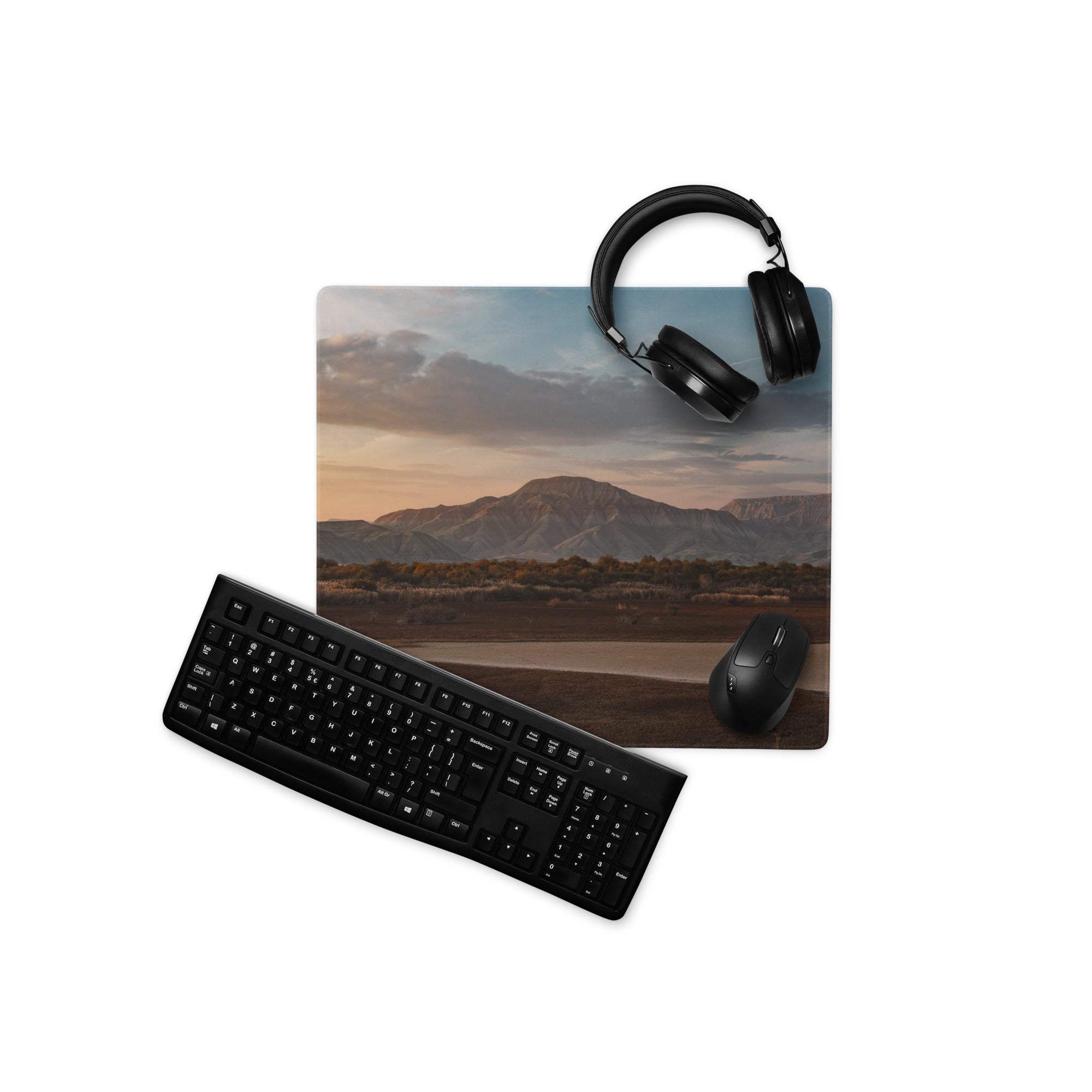 Black wireless keyboard on Sunset Mountain gaming mouse pad