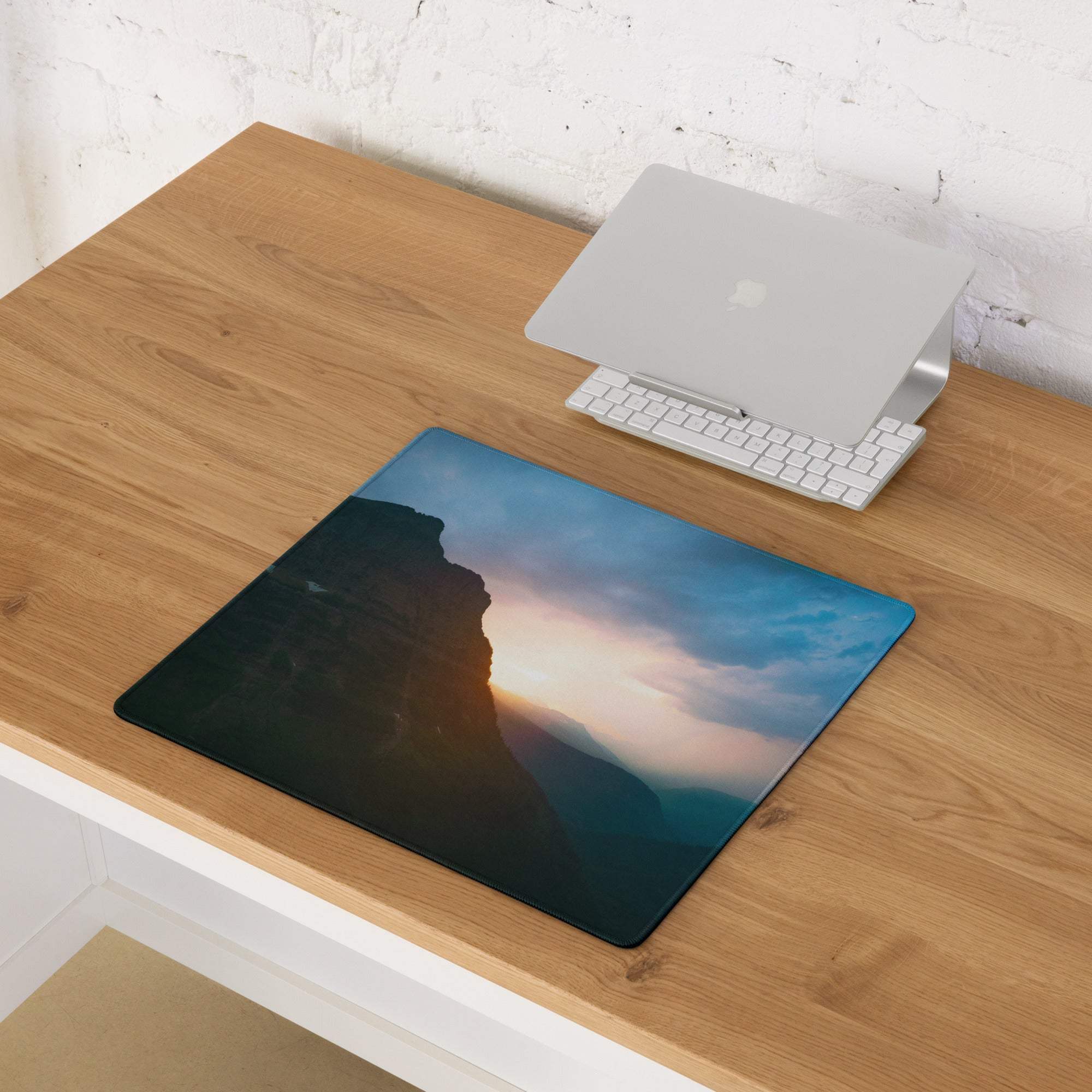 Large Calm Mountain Sunset gaming mouse pad with cliffside sunset design