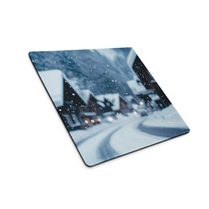Winter snow village gaming mouse pad with blurred snowy rooftops and lights