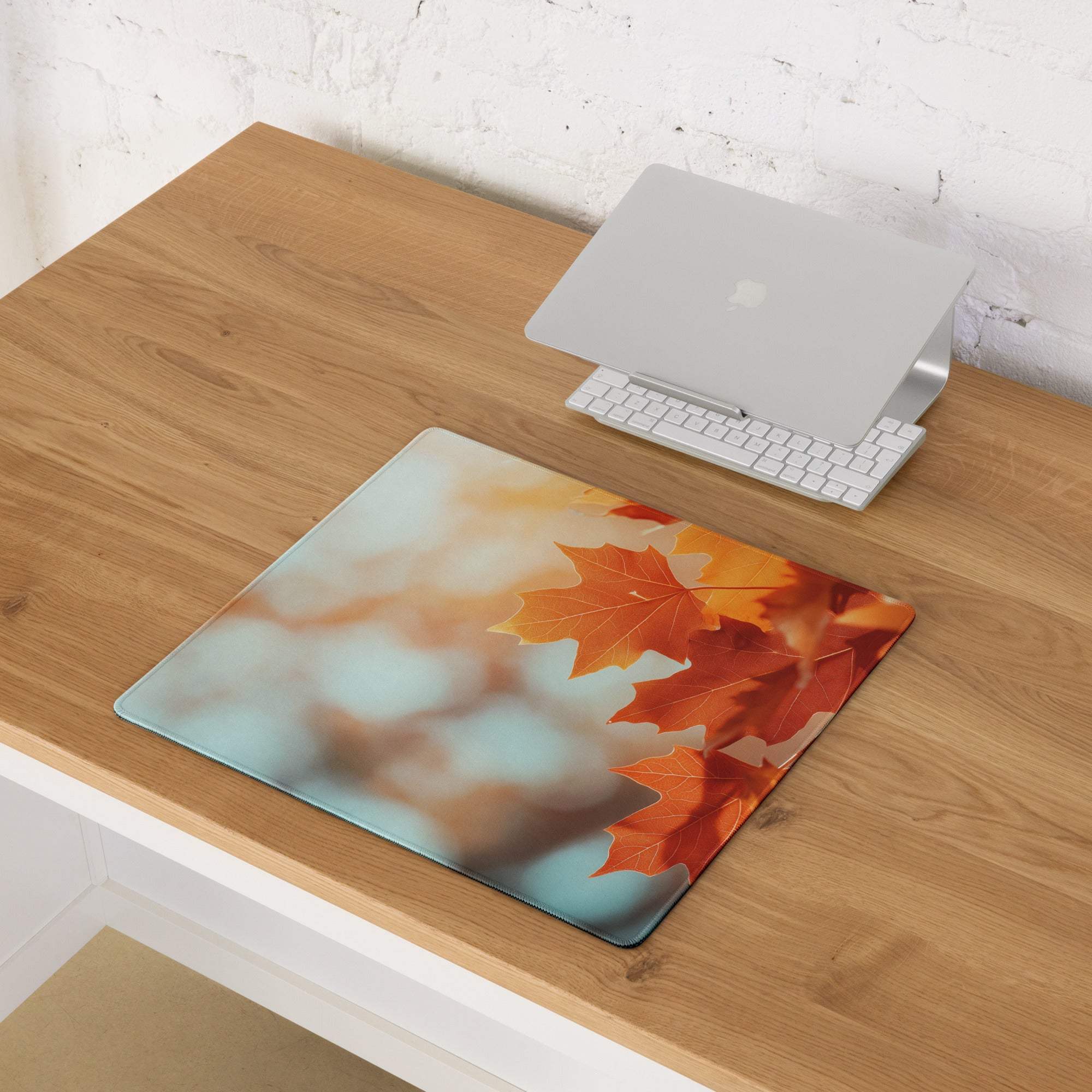Autumn Leaves gaming mouse pad with orange red maple leaves on teal background