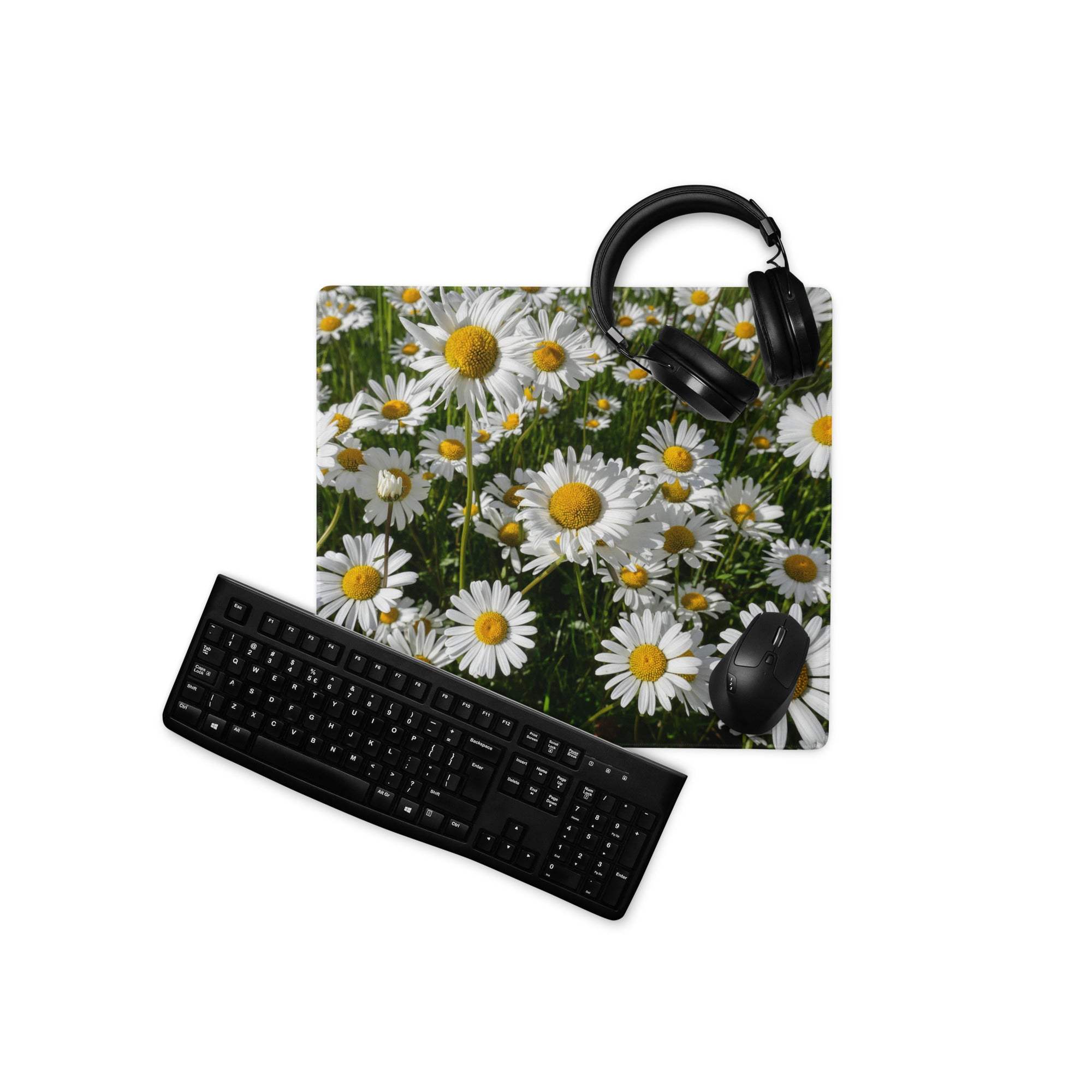 Black keyboard and mouse on vibrant white daisy field gaming mouse pad