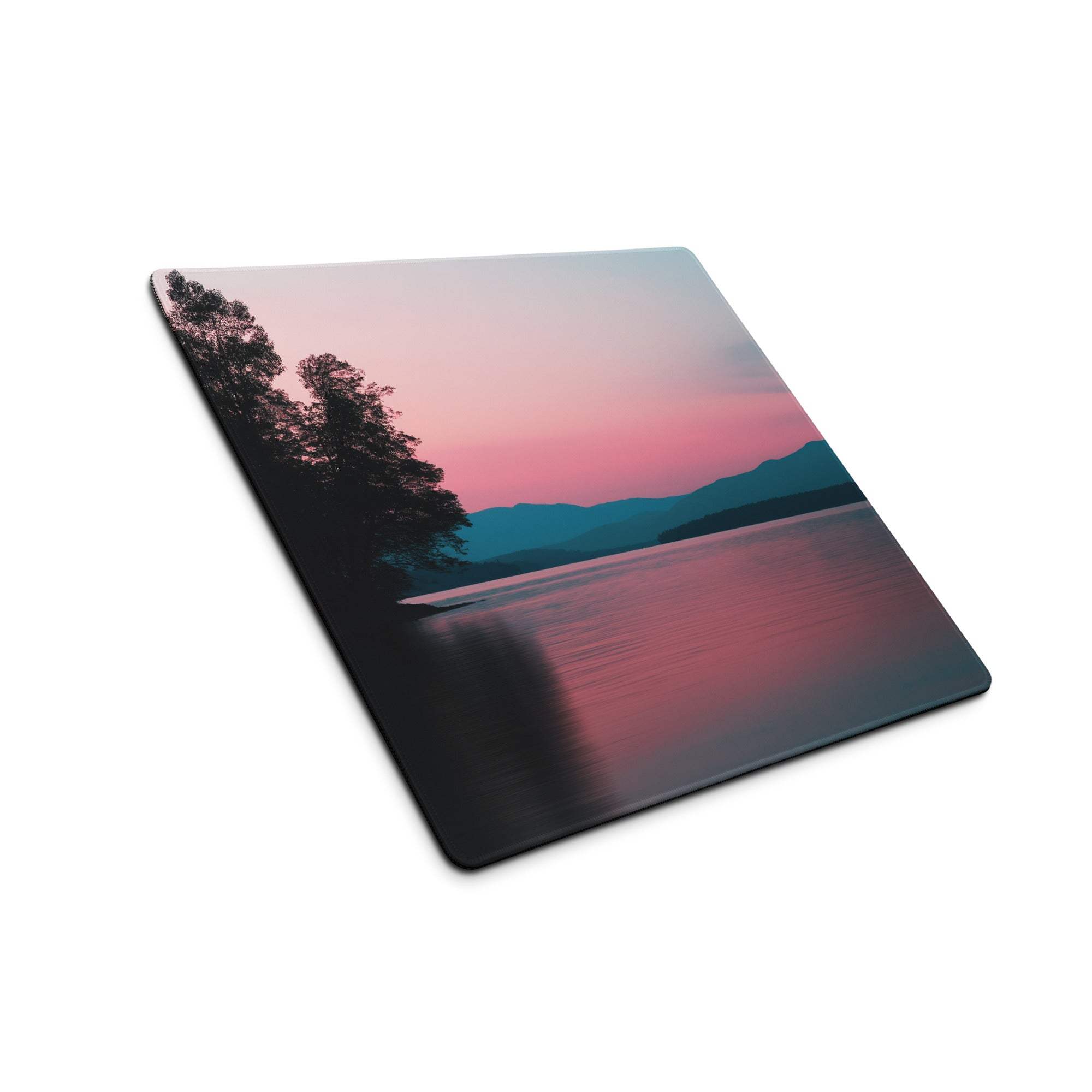 Square glass coaster with calm sunset over water, silhouetted trees, pink purple teal hues