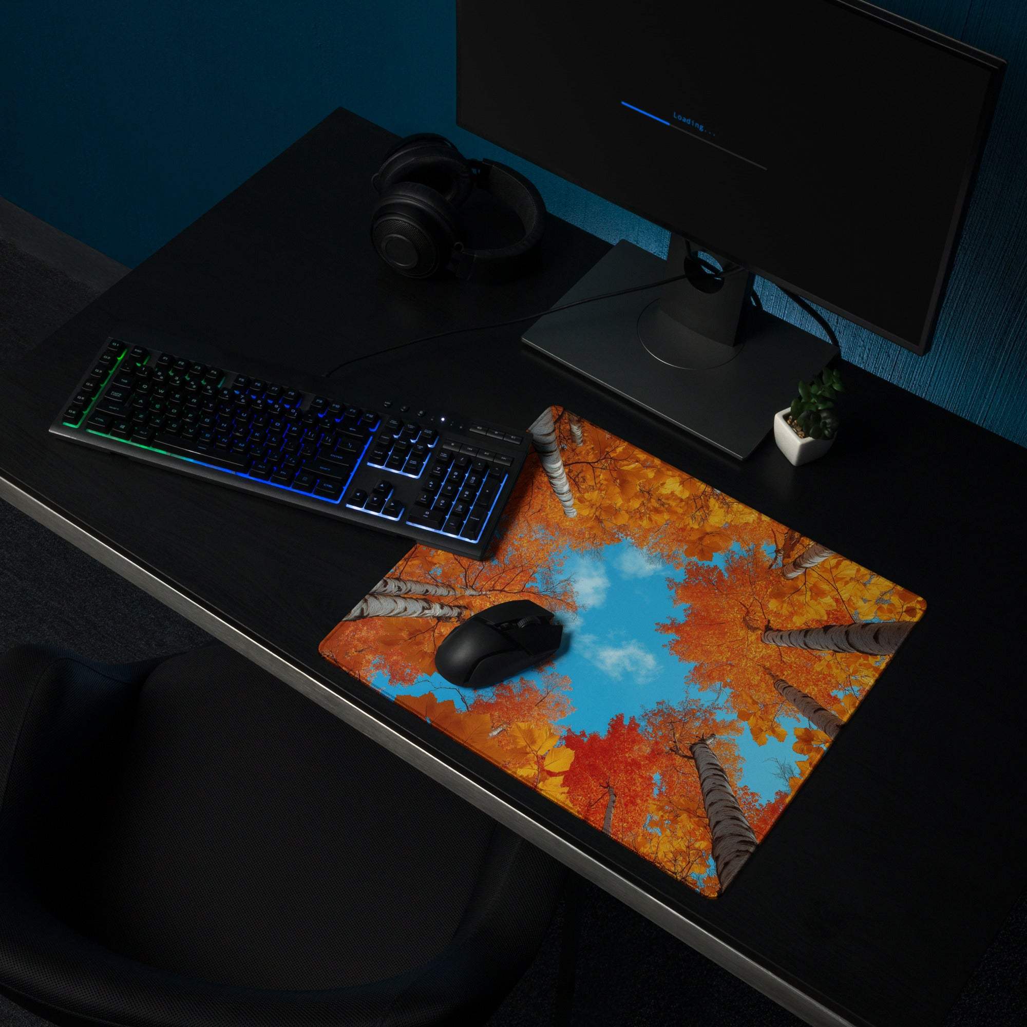 Autumn forest gaming mouse pad with vibrant orange foliage and blue sky