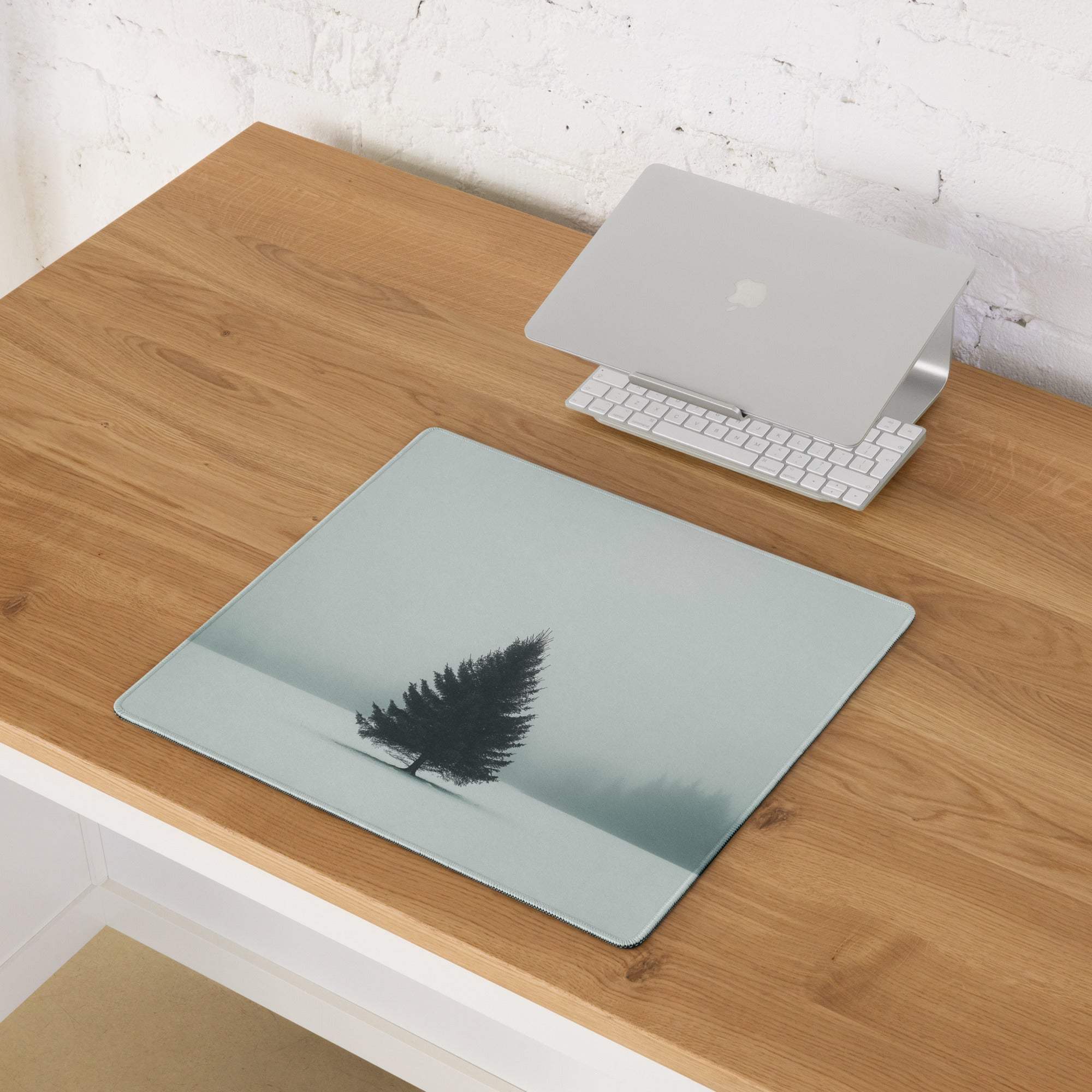 Minimalist light blue snowy pine tree silhouette gaming mouse pad