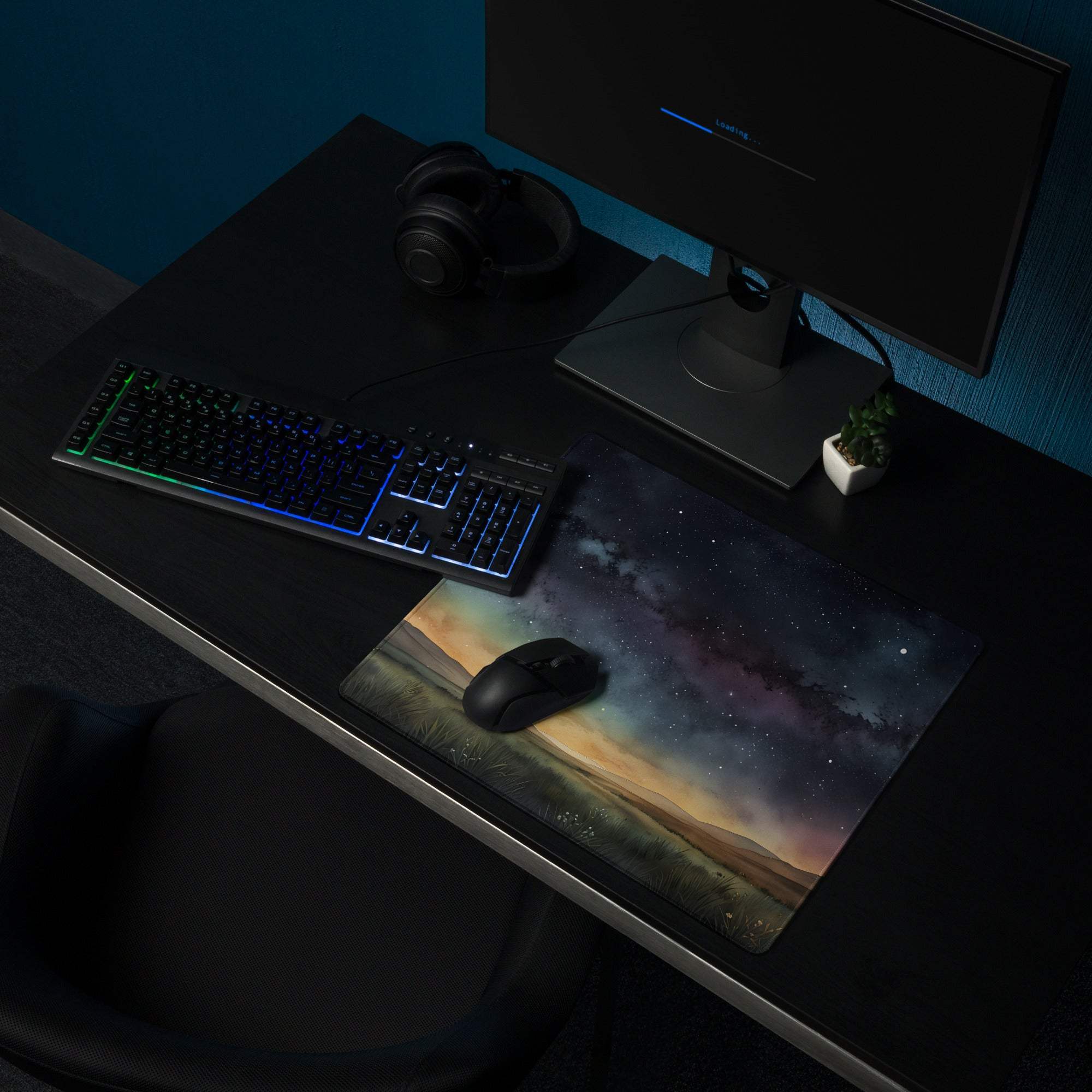 Vivid cosmic mousepad with purple blue nebulae stars and earthy terrain