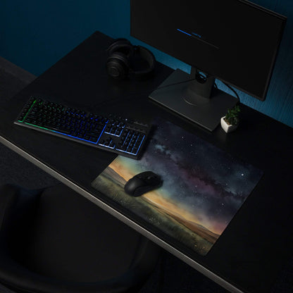 Vivid cosmic mousepad with purple blue nebulae stars and earthy terrain