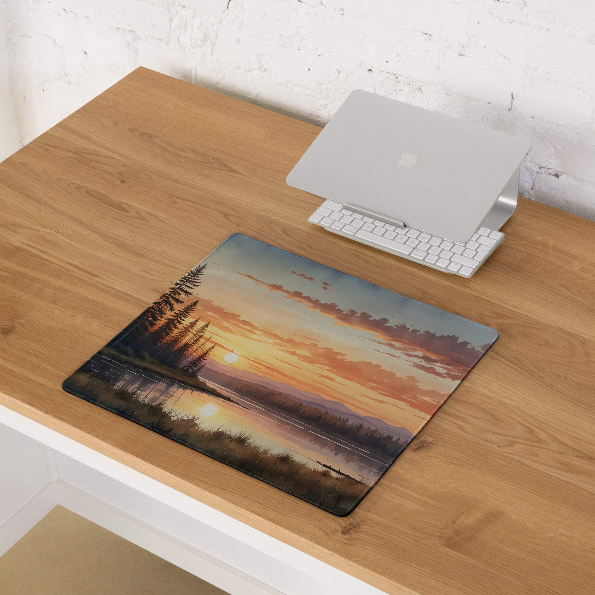 Serene sunset over water with silhouetted trees on large gaming mouse pad