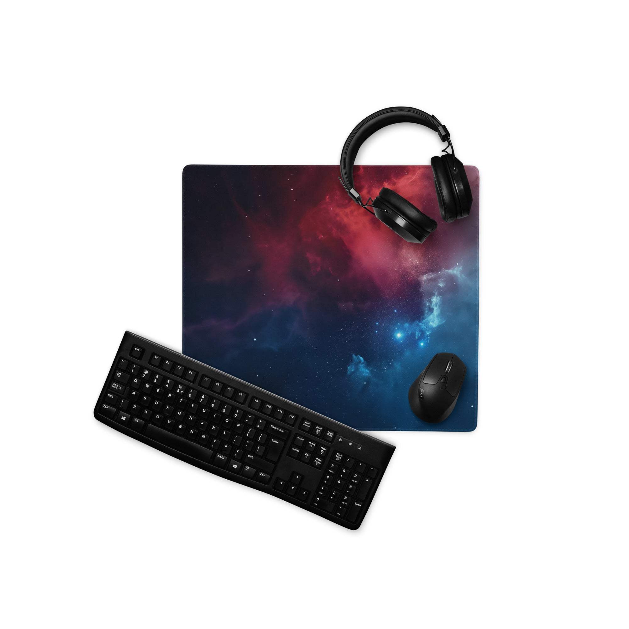 Black keyboard on cosmic nebula space gaming mouse pad