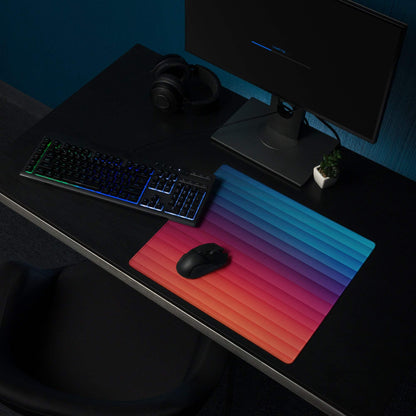 Professional gradient rainbow gaming mouse pad with large size, non-slip base, vibrant red-to-blue gradient, and grip ridges