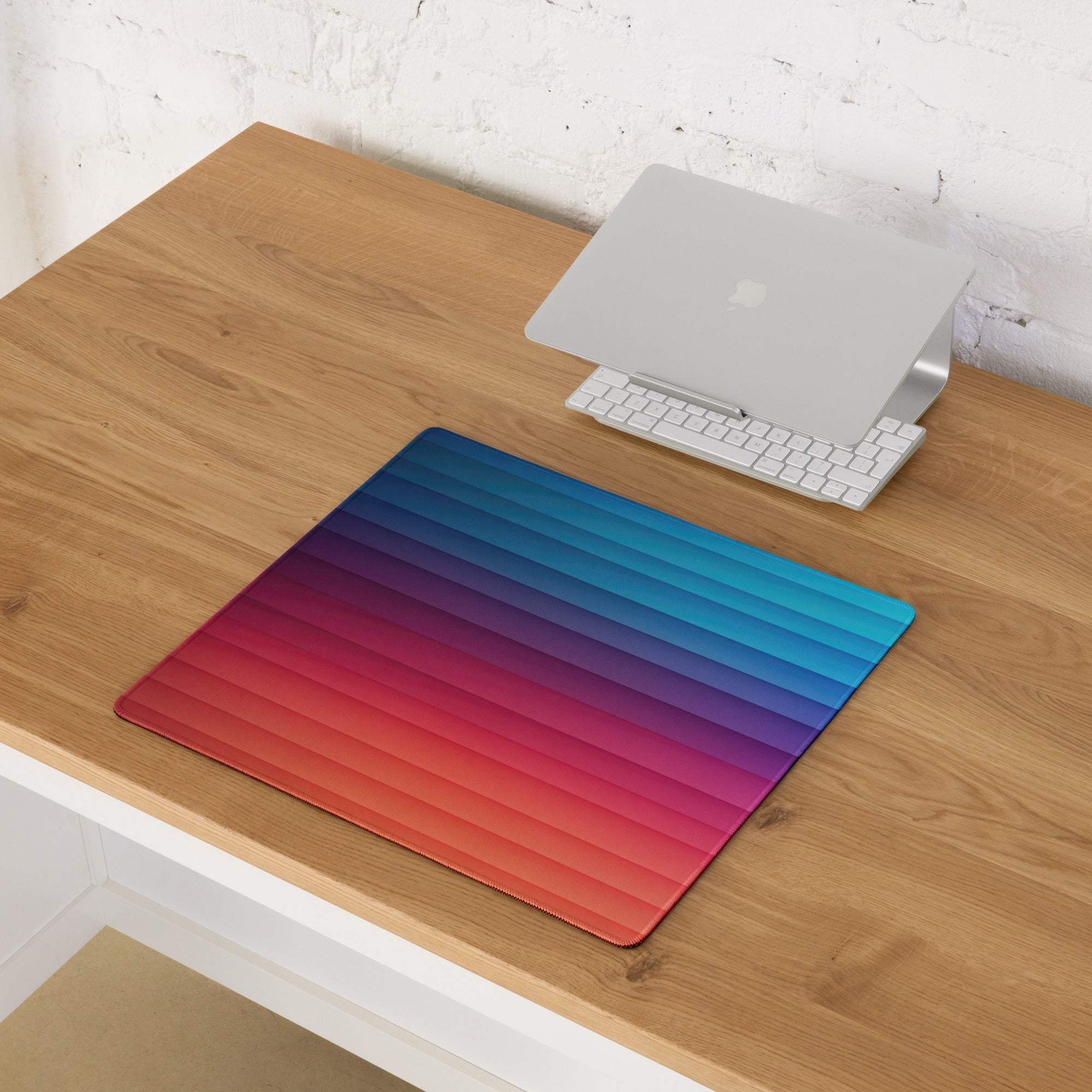 Professional gradient rainbow gaming mouse pad with large size, non-slip base, orange-to-blue gradient and ribbed texture