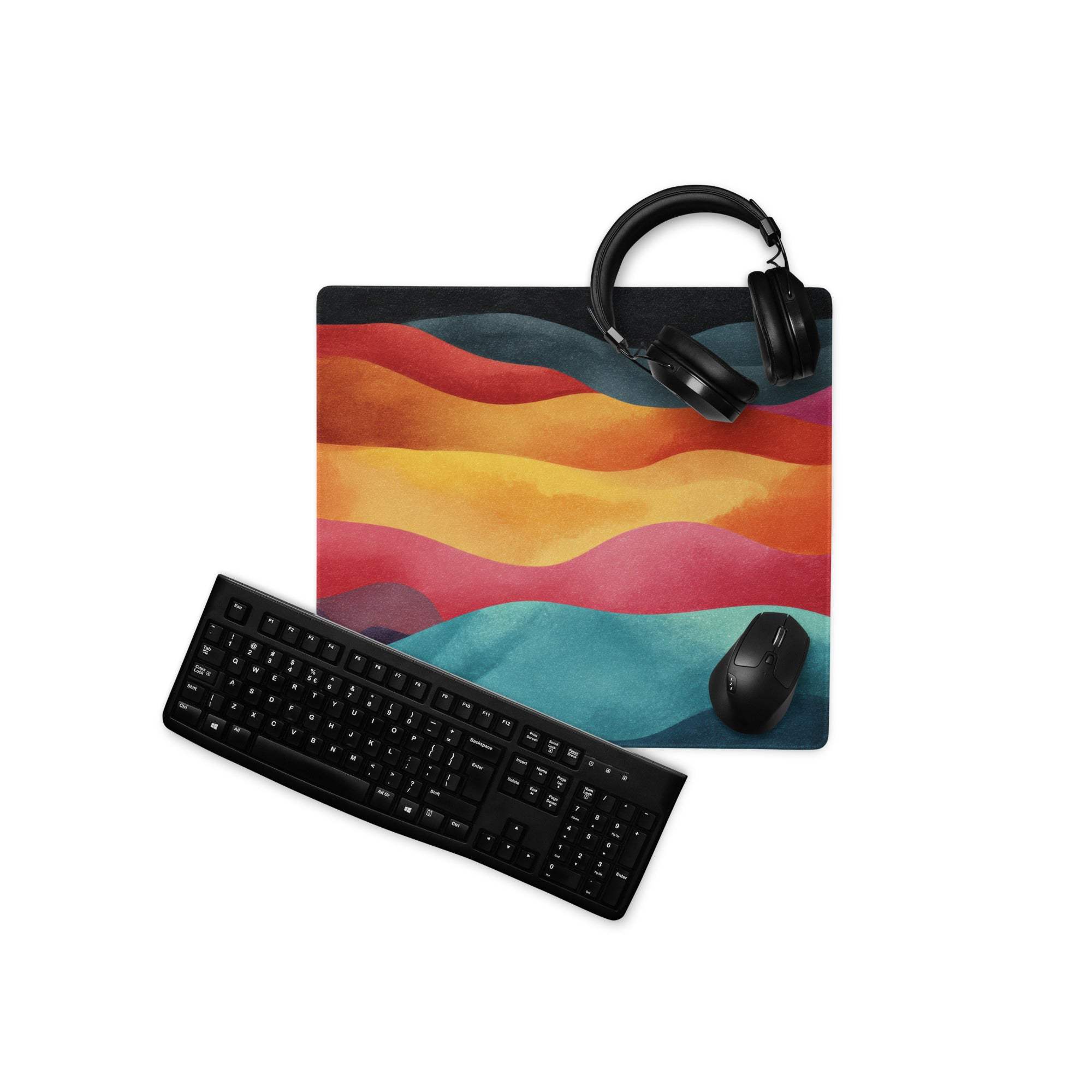 Vibrant rainbow wave gaming mouse pad with black headphones and keyboard