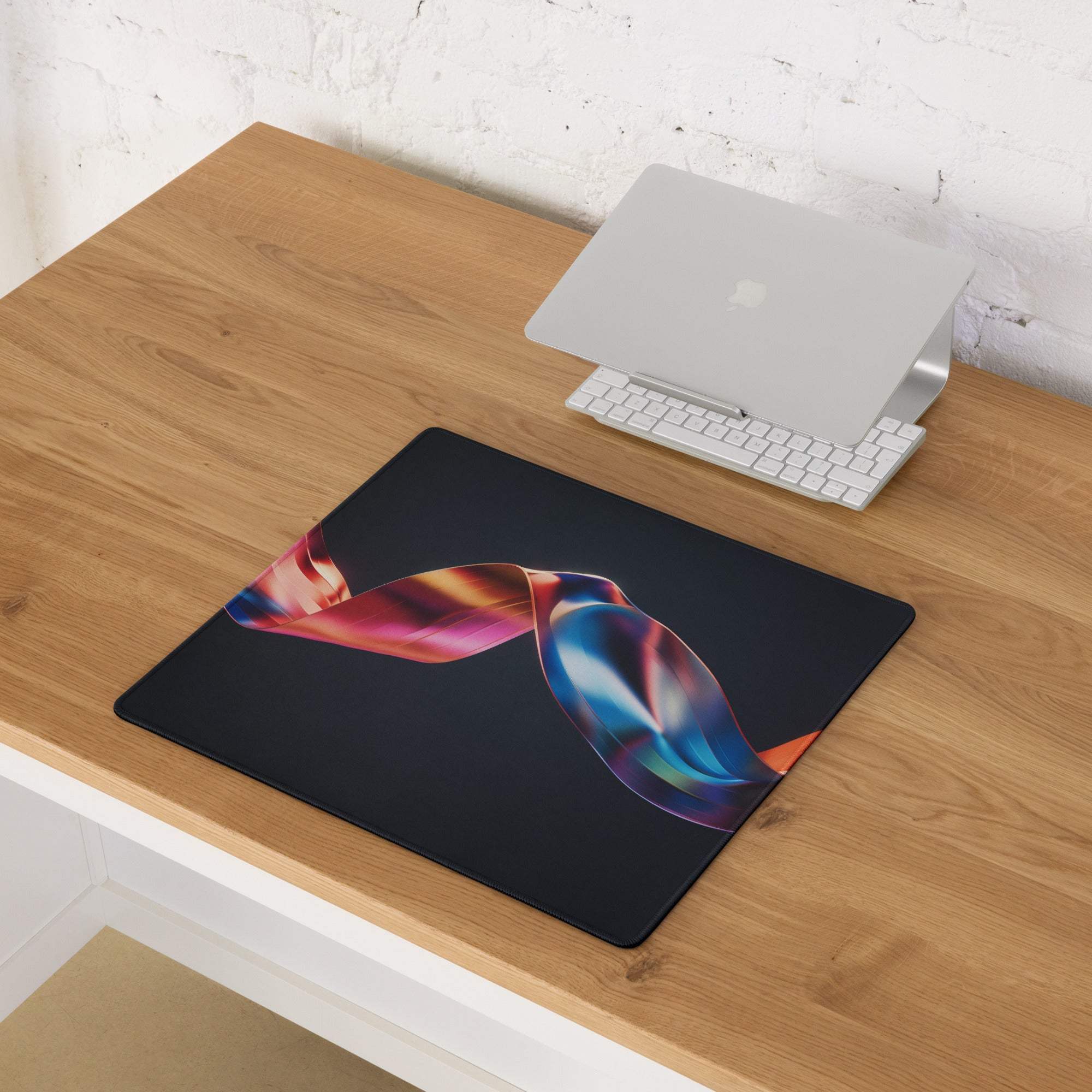 Premium black gaming mouse pad with colorful ribbon design, non-slip base, stitched edges