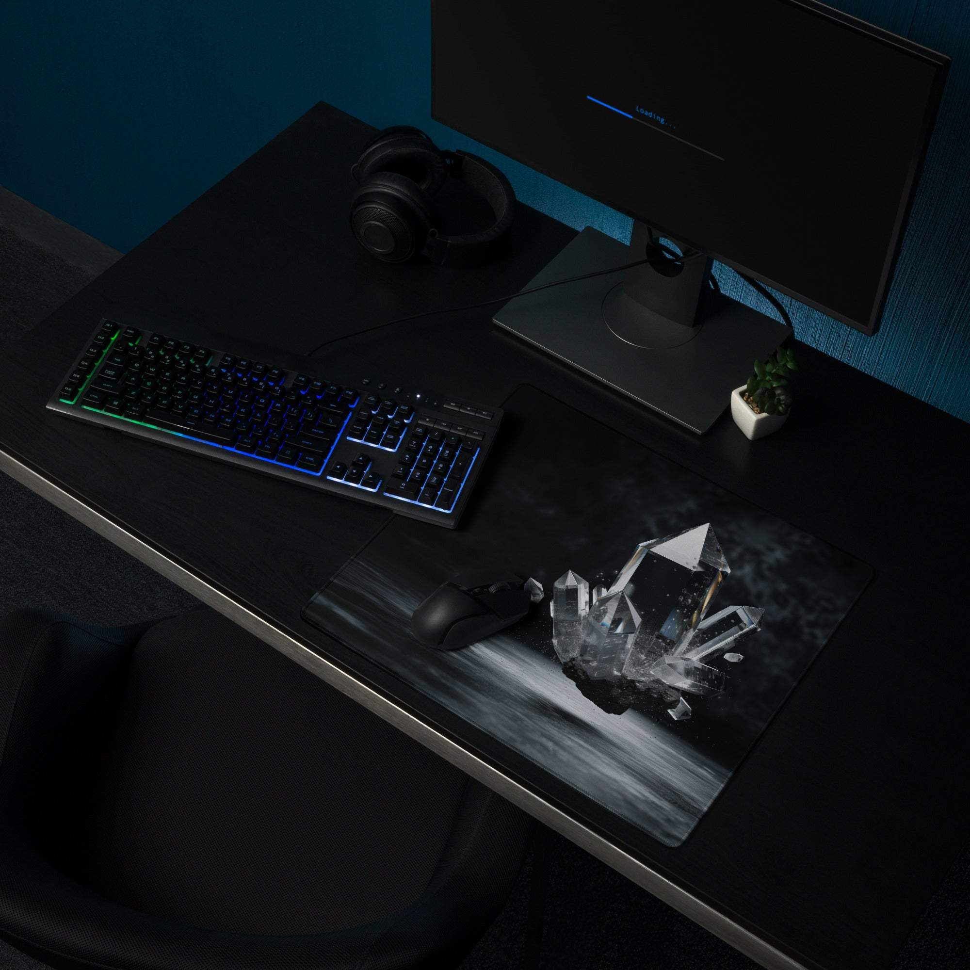 Black gaming mousepad with grayscale crystal formations, non-slip base, stitched edges