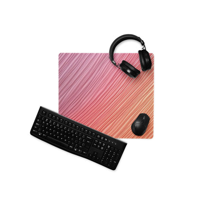 Pink gradient gaming mouse pad with black keyboard and headphones