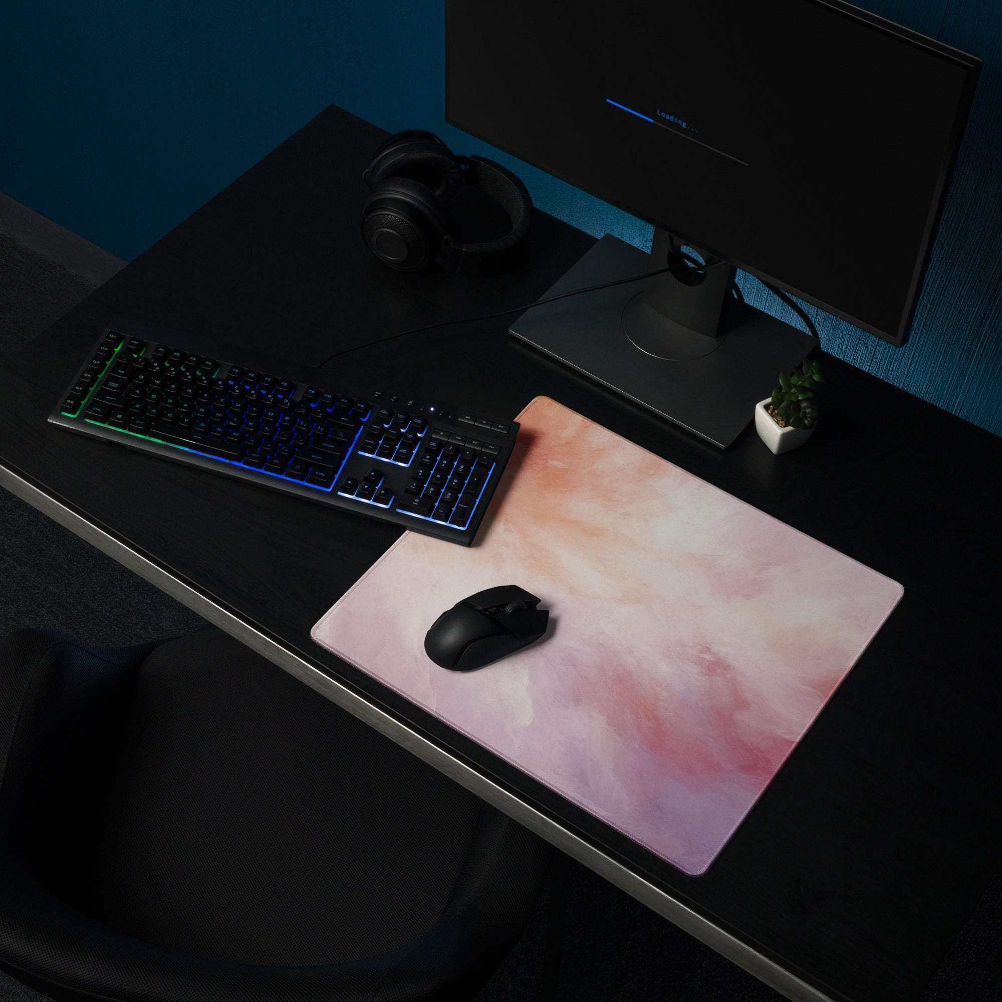 Pastel cloud gaming mouse pad with pink peach gradient on dark desk