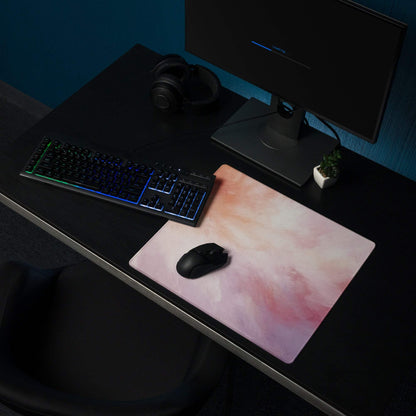 Pastel cloud gaming mouse pad with pink peach gradient on dark desk