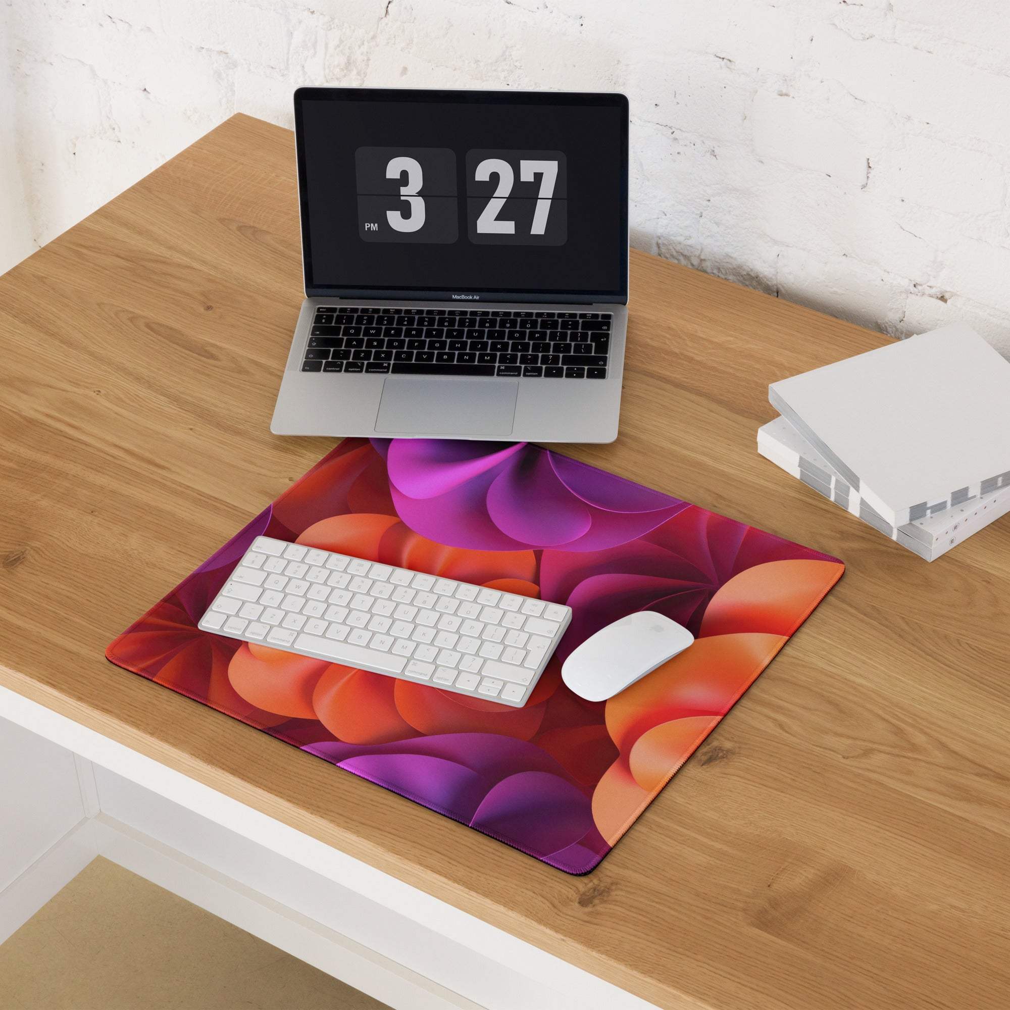 Vibrant abstract floral gaming mouse pad in purple orange red gradient with stitched edges