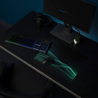 Black gaming mousepad with glowing teal wave design, non-slip edge stitching
