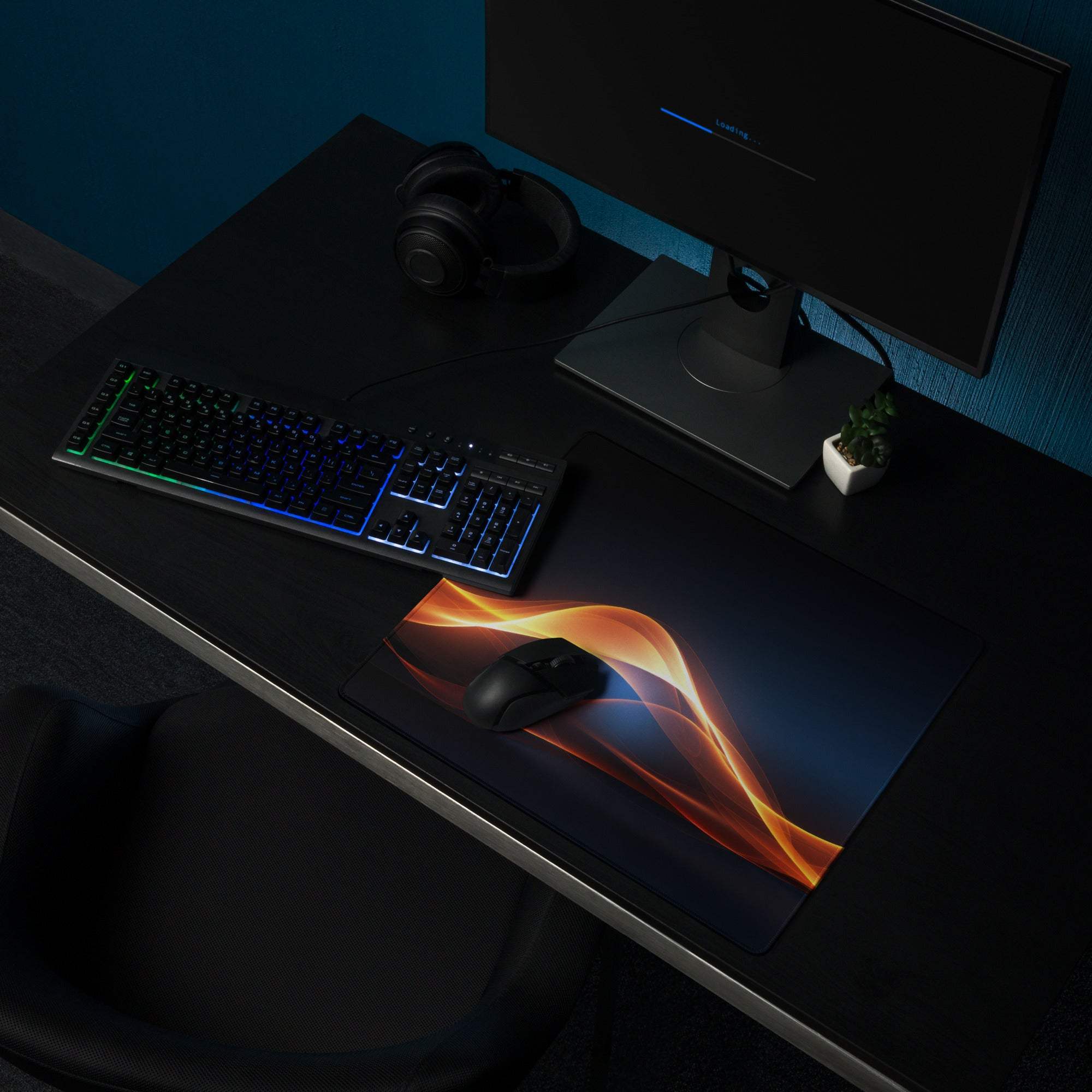 Black gaming mousepad with vibrant orange blue flame design and non-slip base
