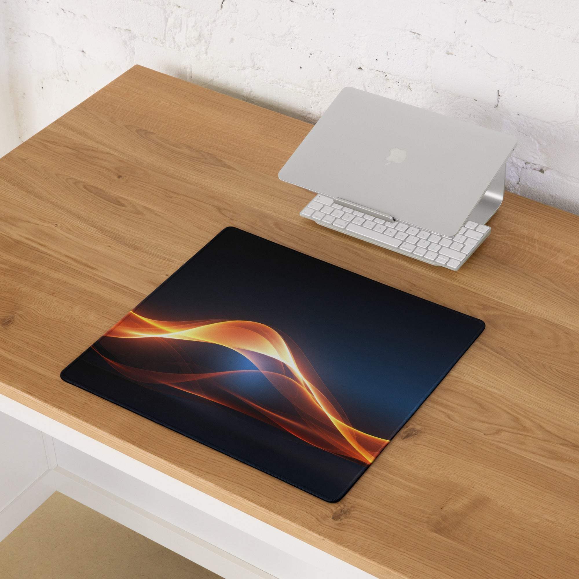 Black mousepad with vibrant orange gold flame design and non-slip base