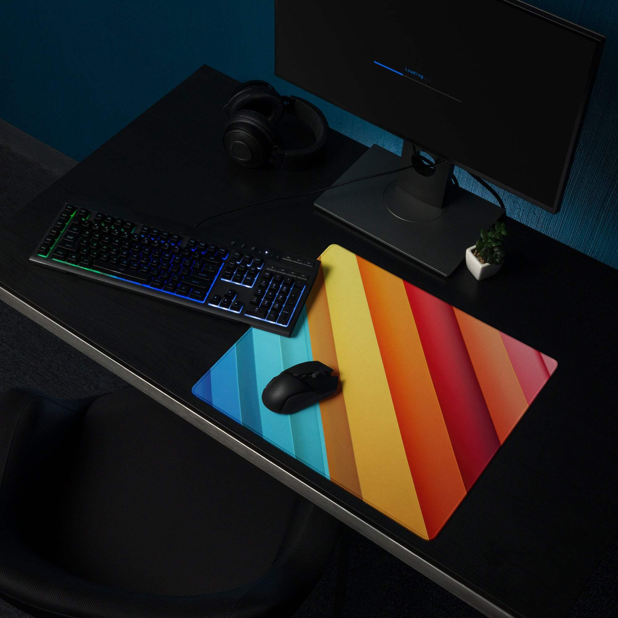 Vibrant rainbow gradient gaming mouse pad with diagonal stripes, non-slip base, edge stitching