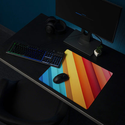 Vibrant rainbow gradient gaming mouse pad with diagonal stripes, non-slip base, edge stitching