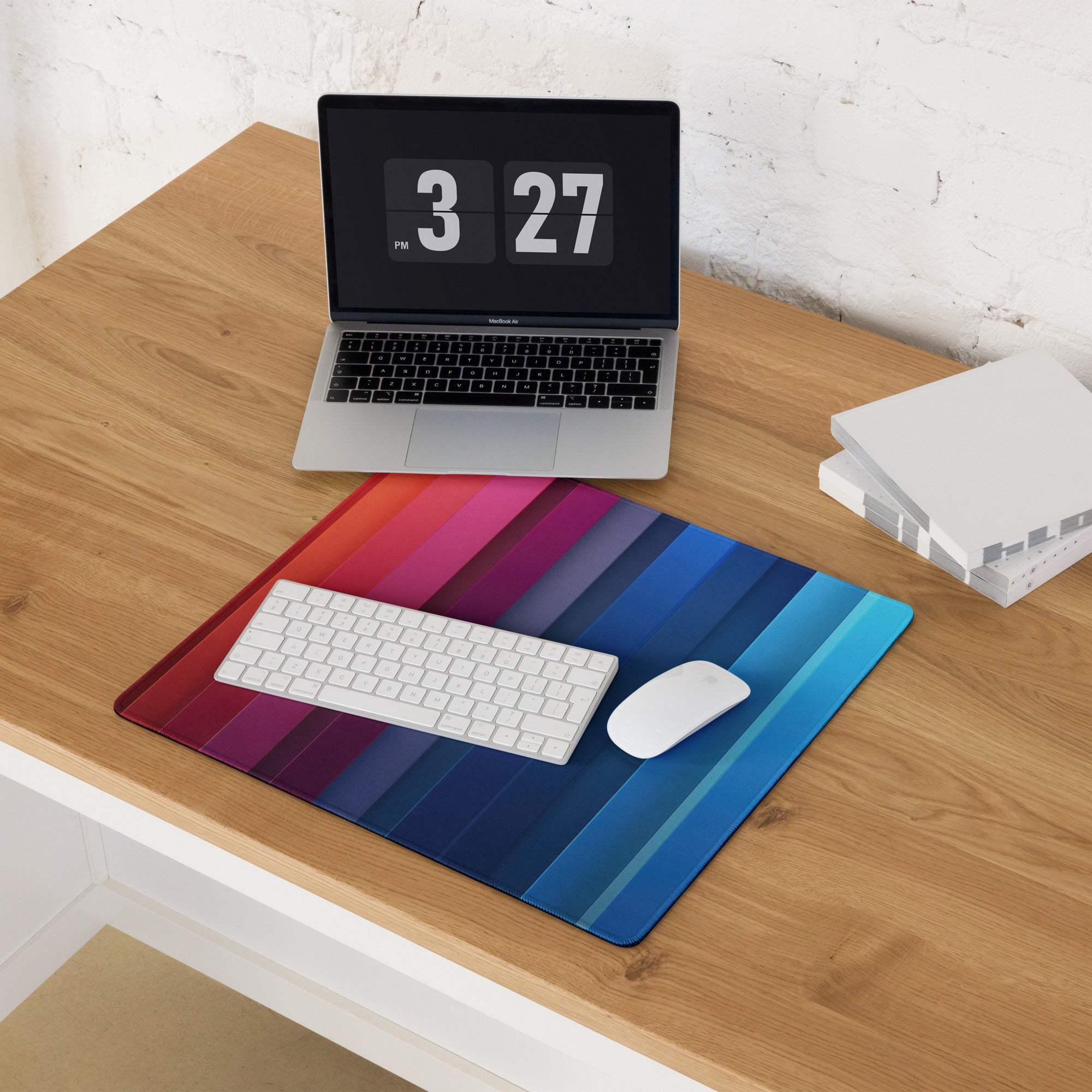 Vibrant rainbow gradient gaming mouse pad with diagonal red-to-blue stripes