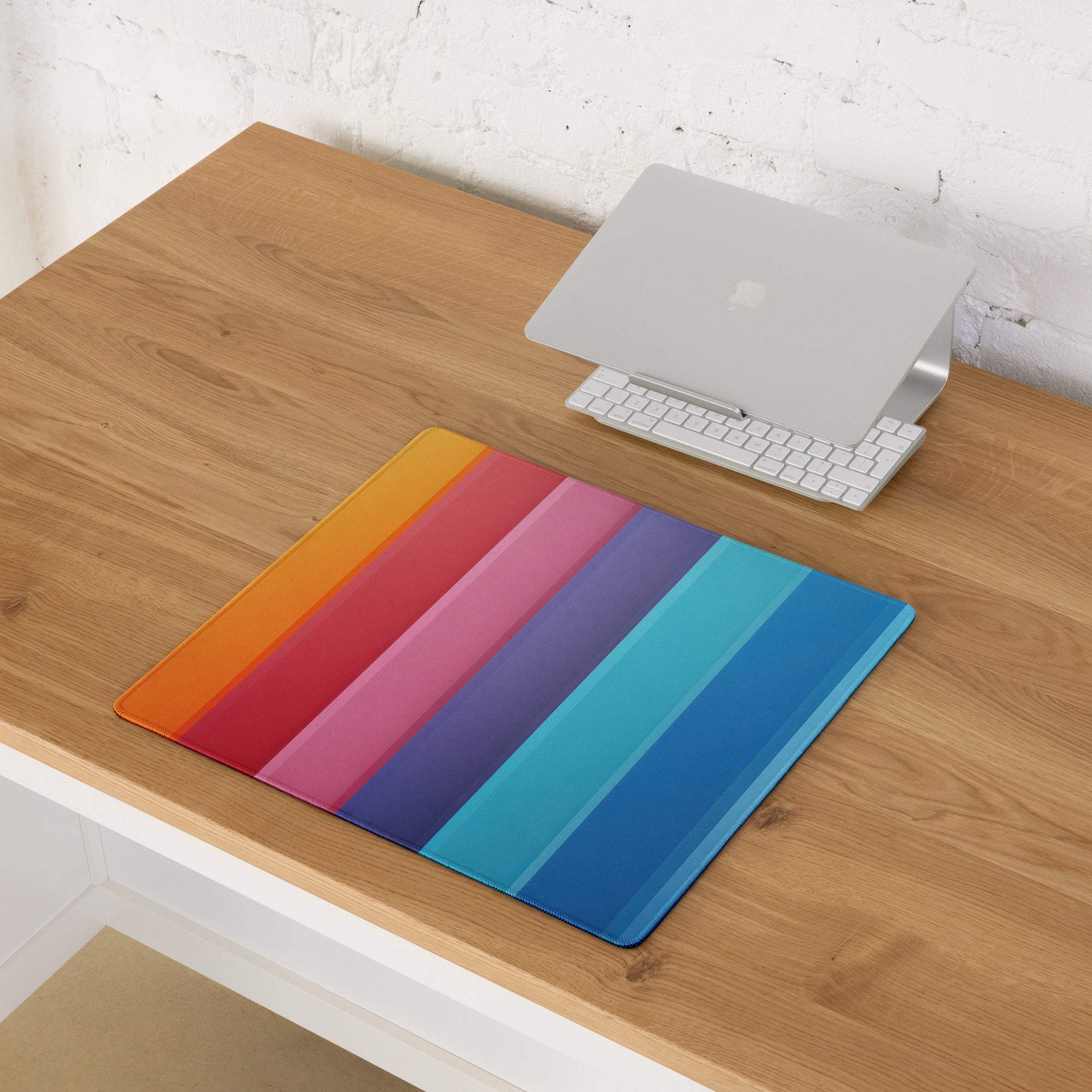 Vibrant rainbow stripe gaming mouse pad with glossy surface and soft corners