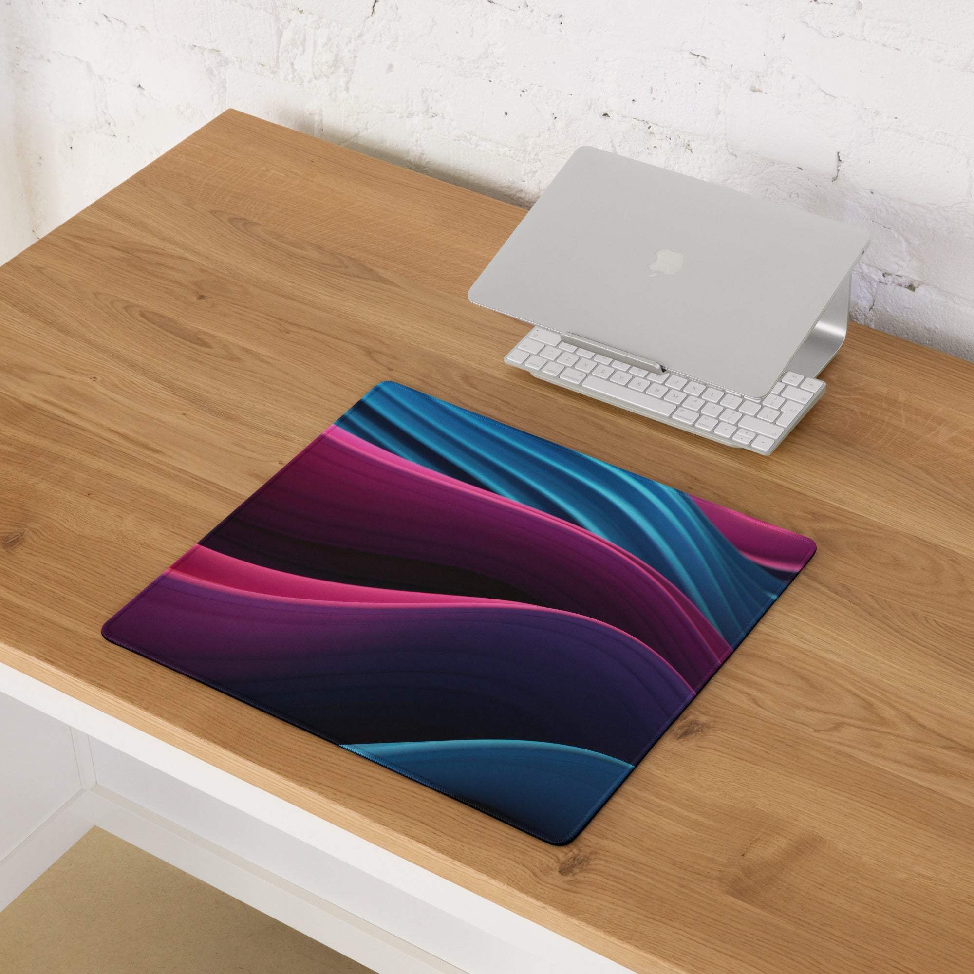 Large vibrant abstract wave gaming mouse pad with non-slip base and stitched edges