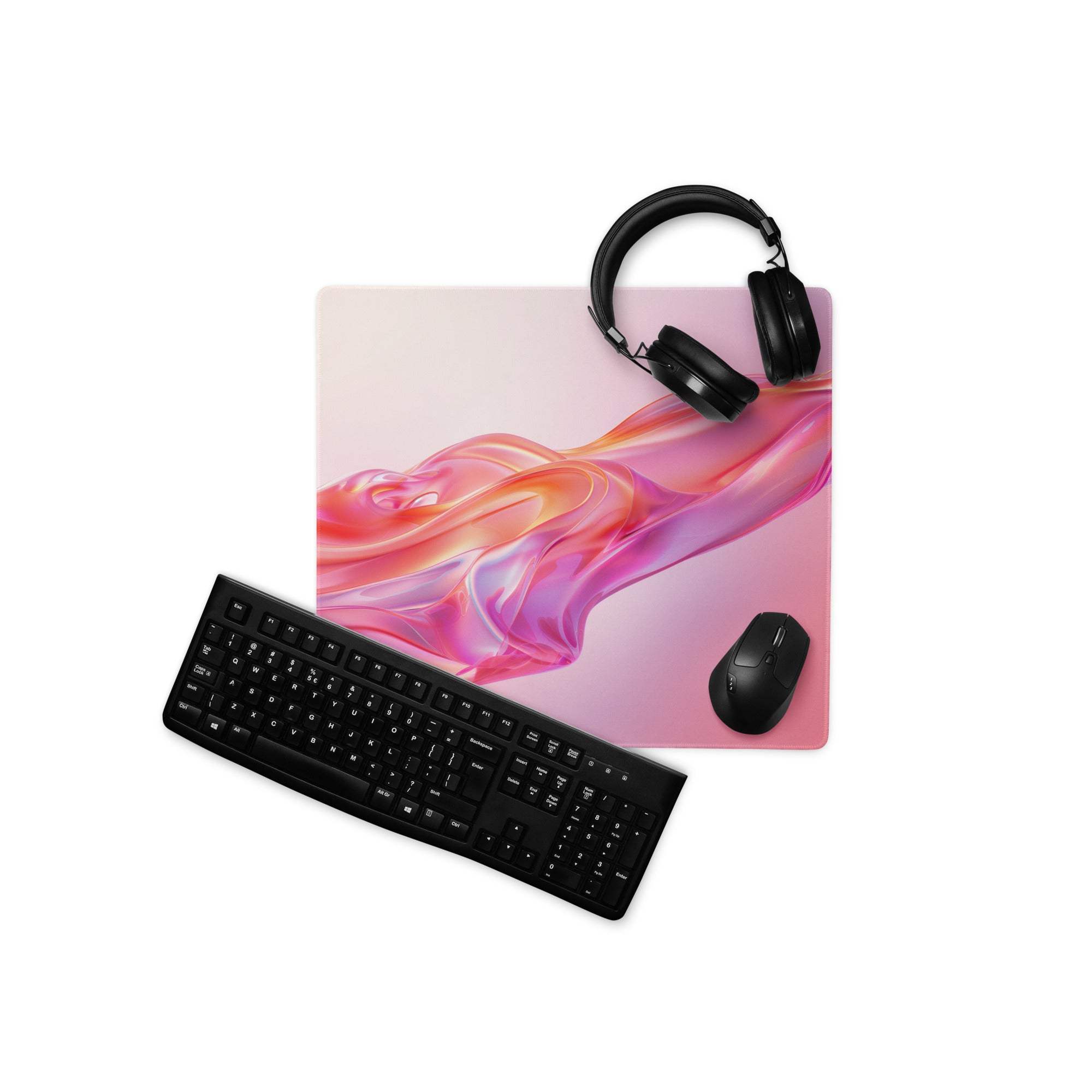 Vibrant pink gradient gaming mouse pad with black keyboard and headphones