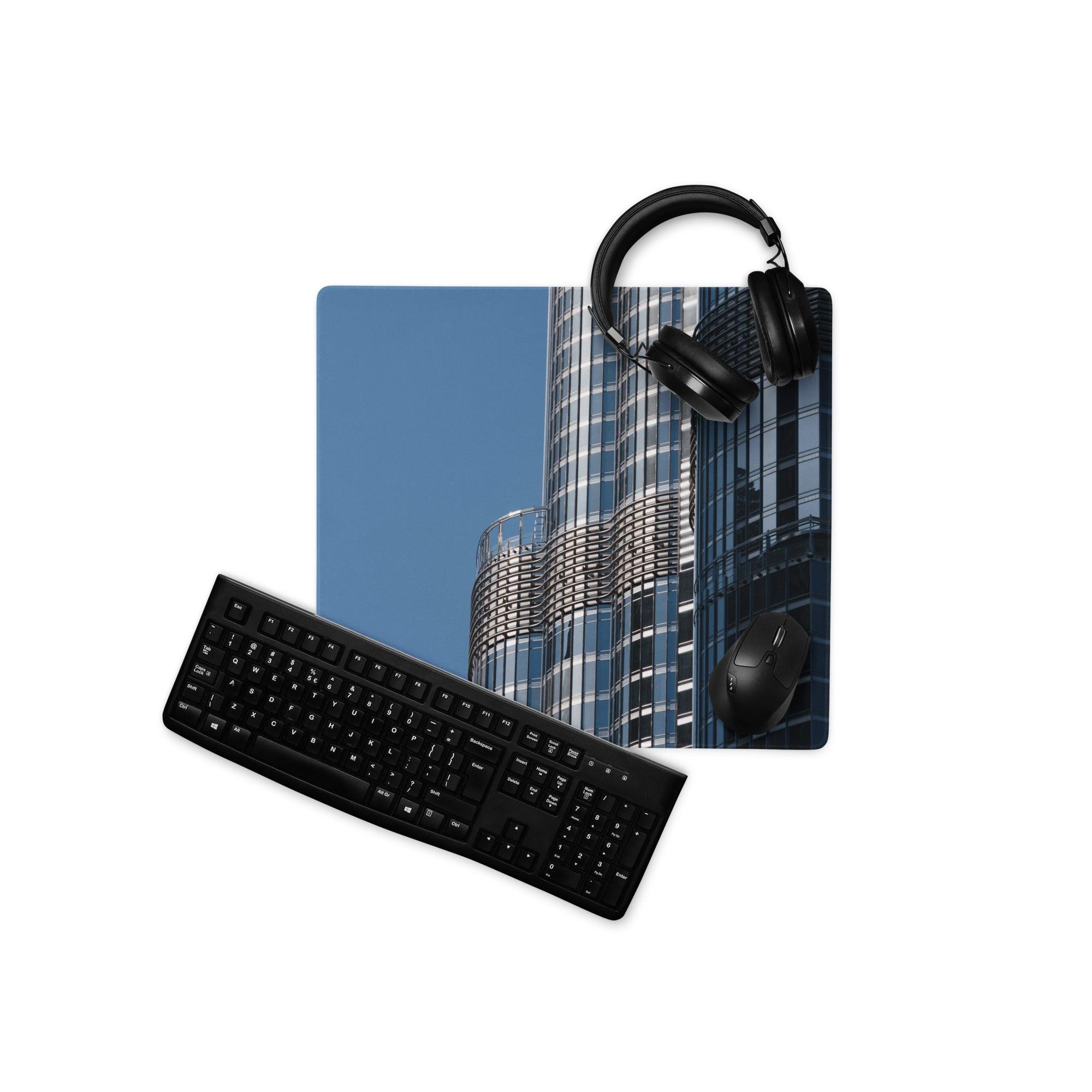 Black keyboard, silver-accent mouse on premium blue cityscape gaming mousepad