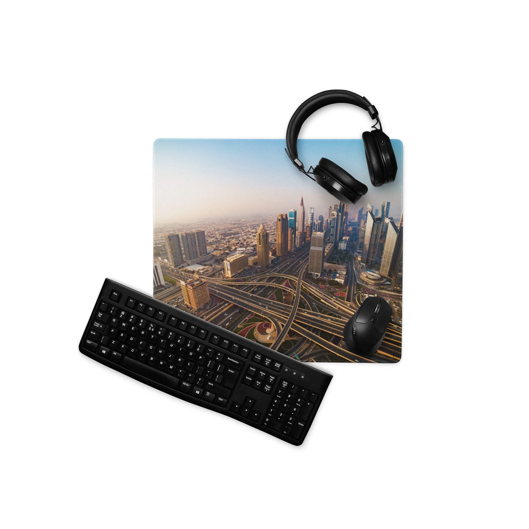 Large warm sunset urban skyline gaming mousepad with black keyboard, mouse, headphones