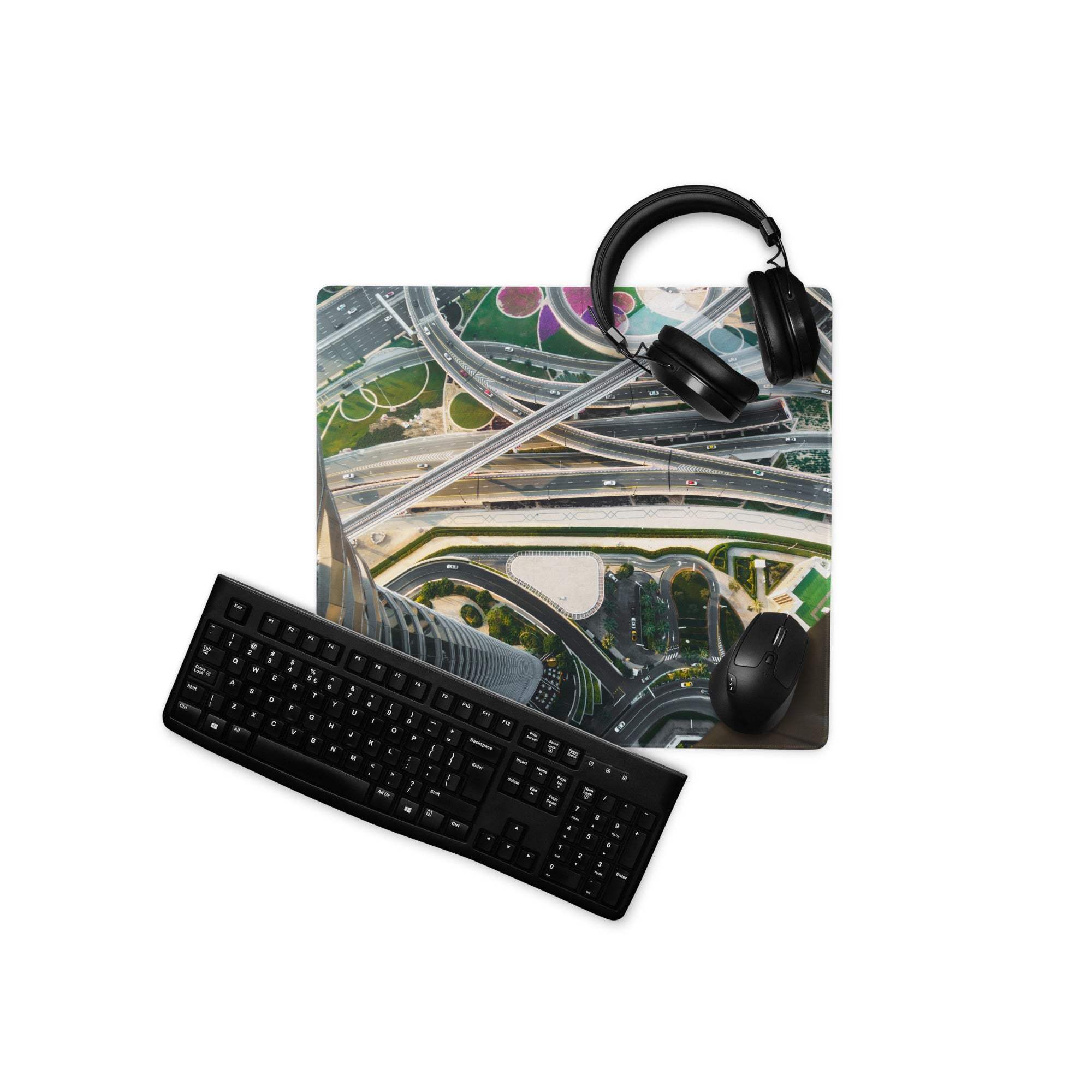 Black keyboard and mouse on cinematic cityscape aerial highway mousepad