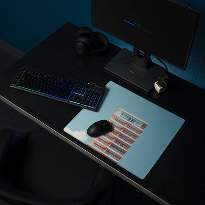 Light blue gaming mouse pad with pinkish-red brick building print