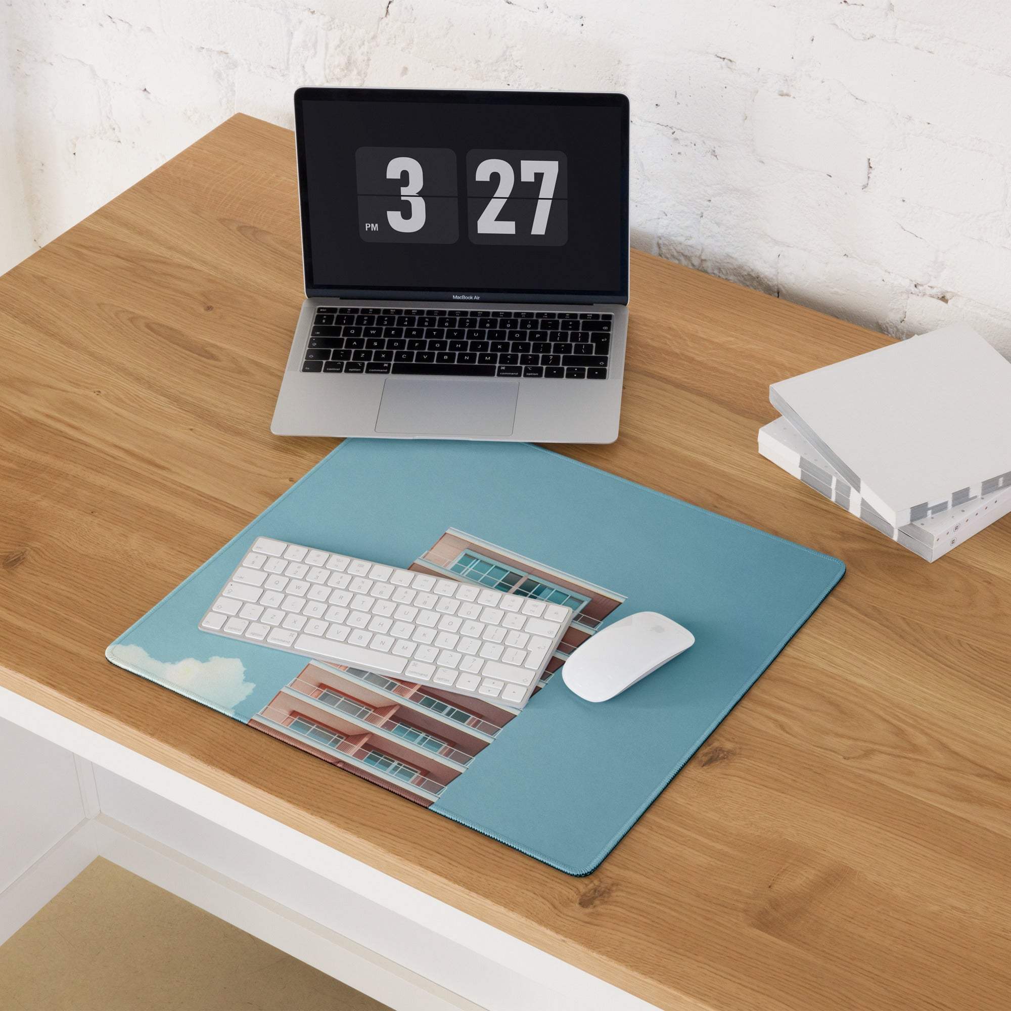 Pastel sky blue gaming mouse pad with building print, keyboard, and mouse
