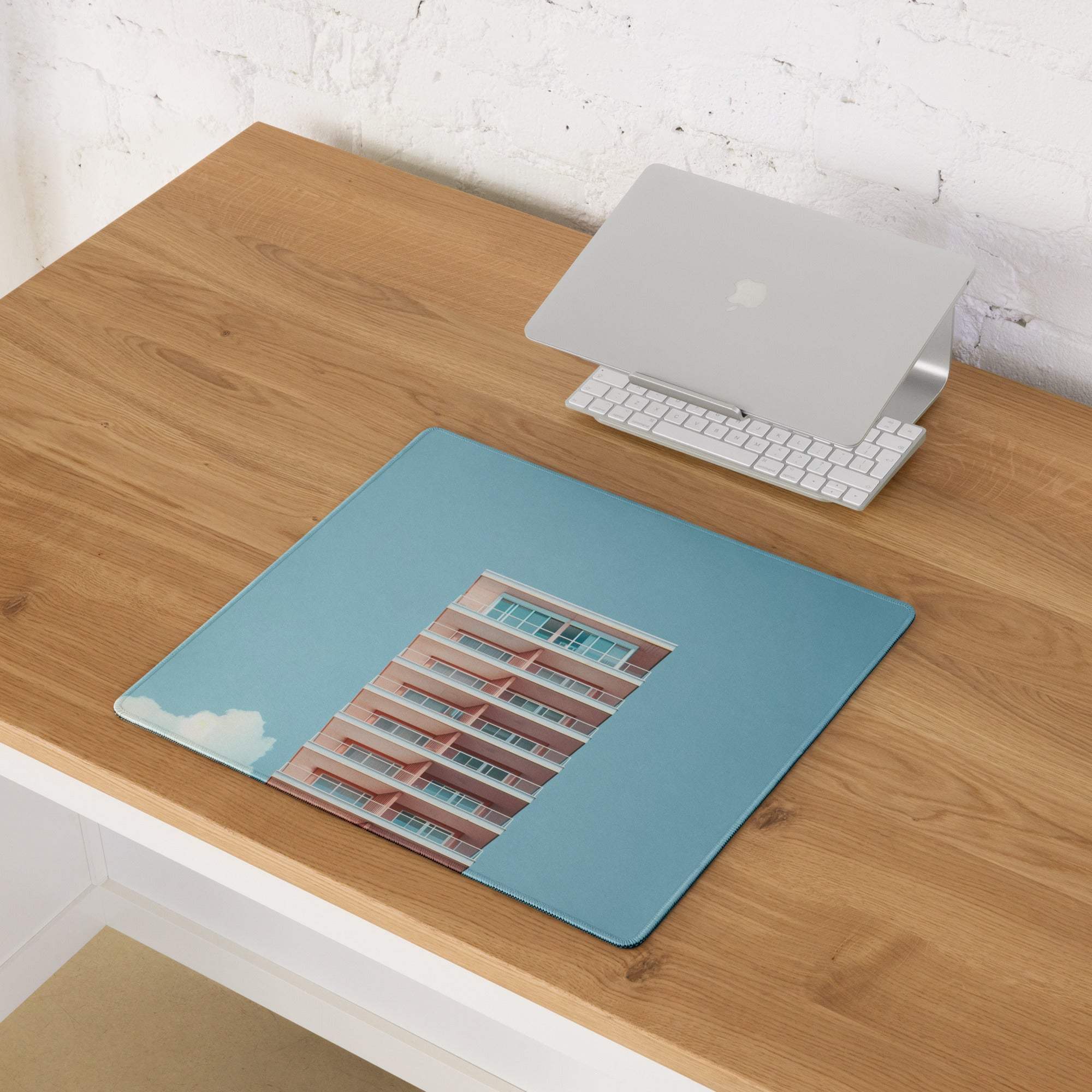Pastel sky blue gaming mouse pad with red brick building design