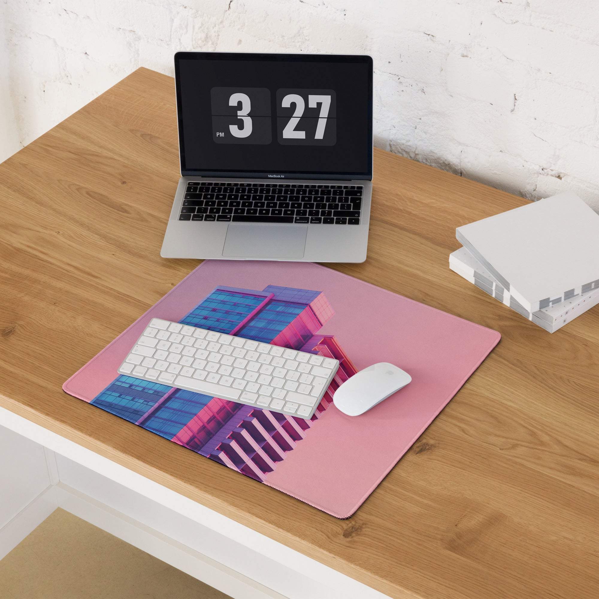 Neon pink gradient cityscape gaming mouse pad with geometric building design