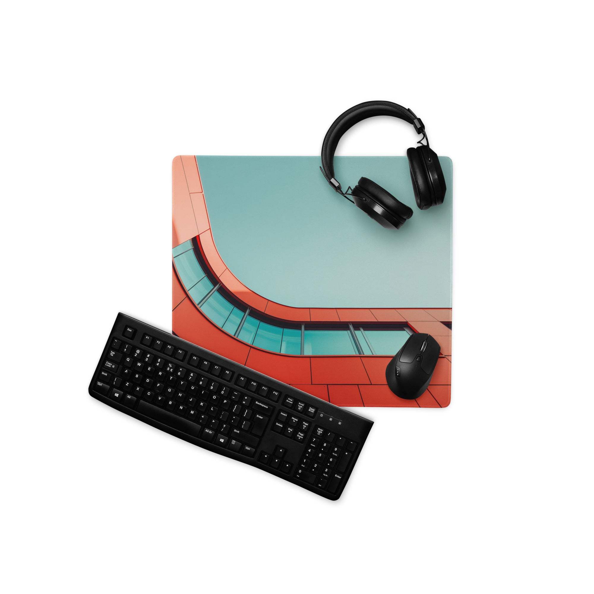 Bold orange red architectural curve gaming mouse pad with teal design and headphones