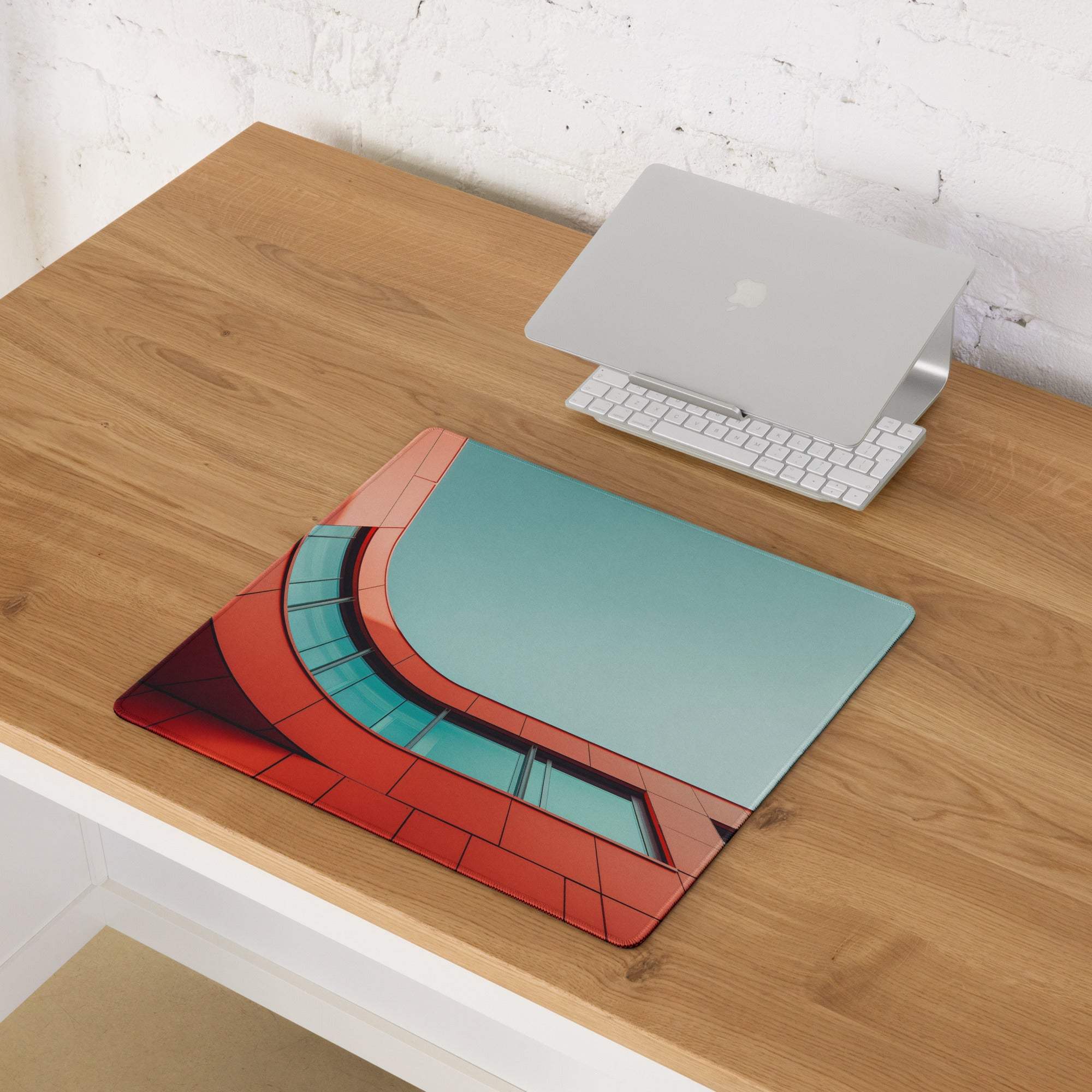 Bold red and teal geometric architectural gaming mouse pad