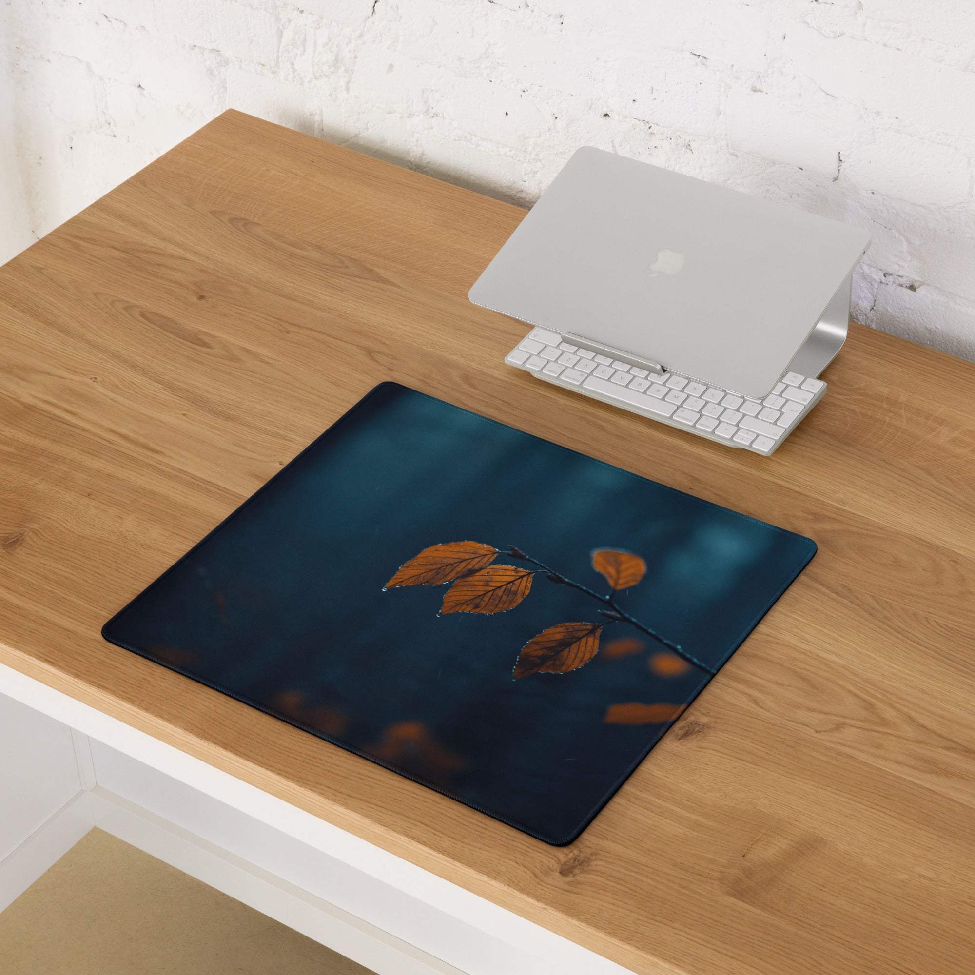 Large Moody Night Scene gaming mouse pad with deep blue base and orange autumn leaves