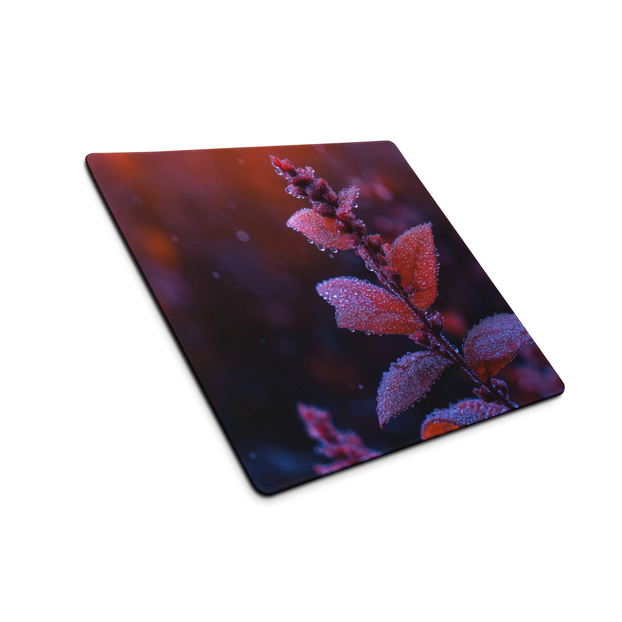 Vibrant red leaf macro close-up on large glossy gaming mouse pad