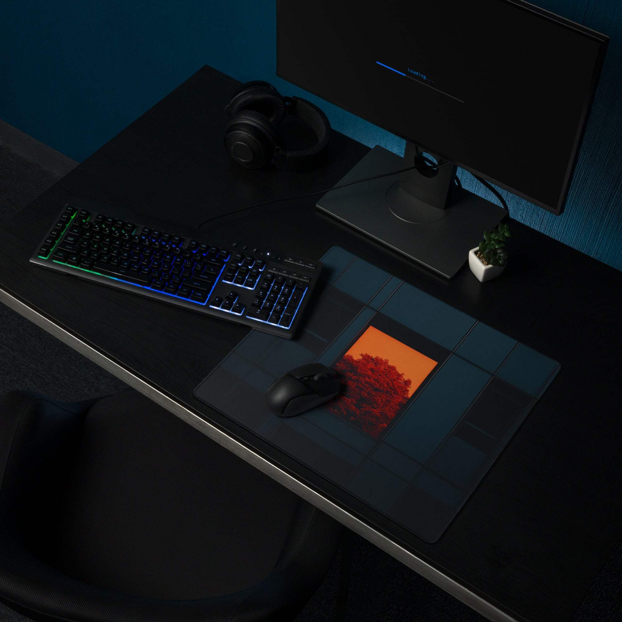 Modern dark blue gaming mouse pad with orange window accent and sunset design