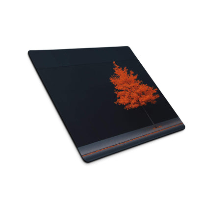 Black rectangular mousepad with vibrant orange tree on dark backdrop