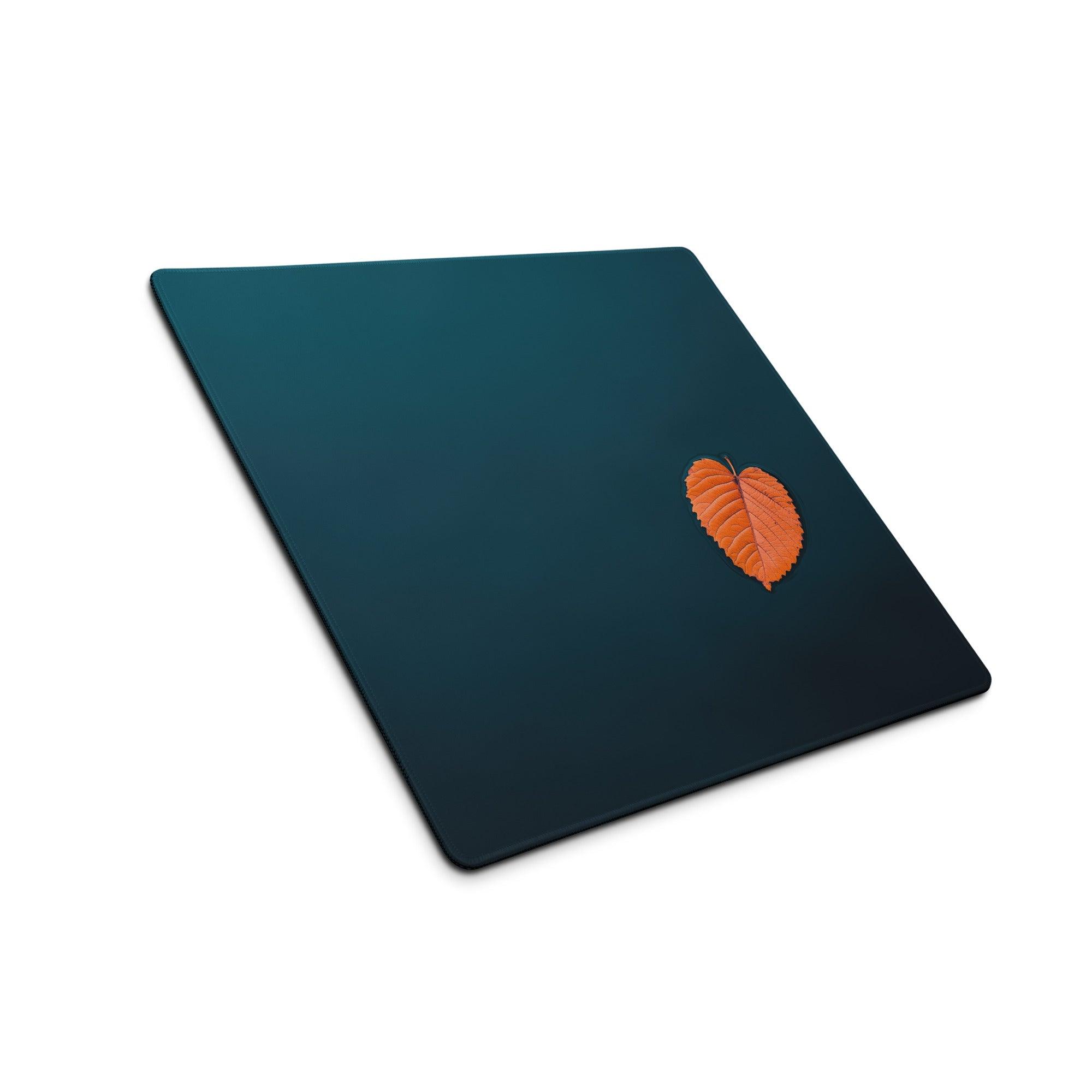 Dark teal placemat with orange leaf on deep ocean blue non-slip gaming mouse pad