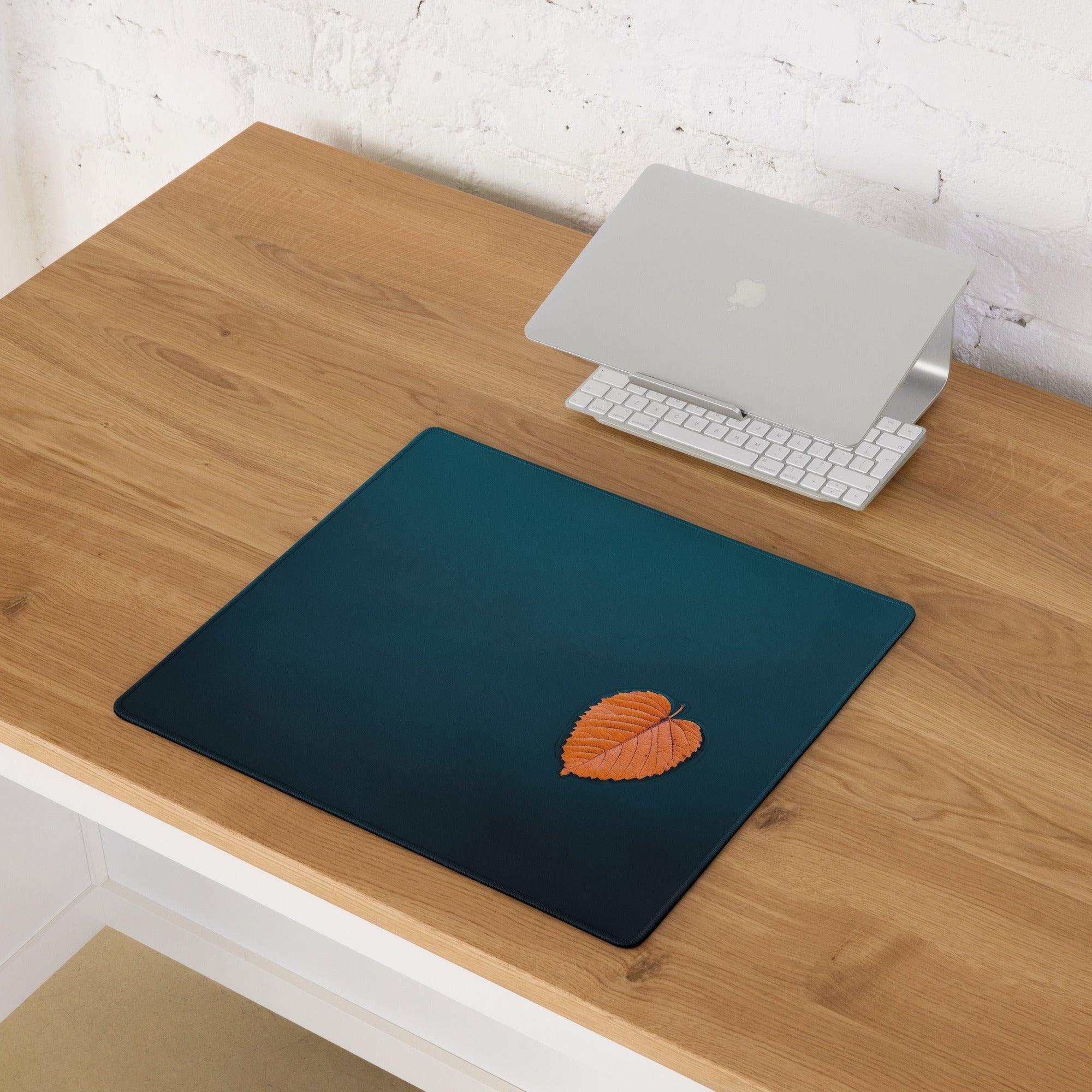 Dark teal large gaming mousepad with orange leaf design