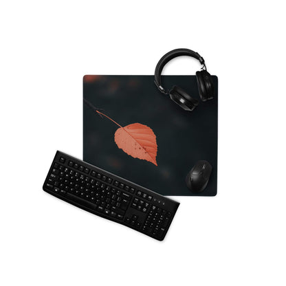 Black minimalist leaf gaming mouse pad with non-slip base and stitched edges