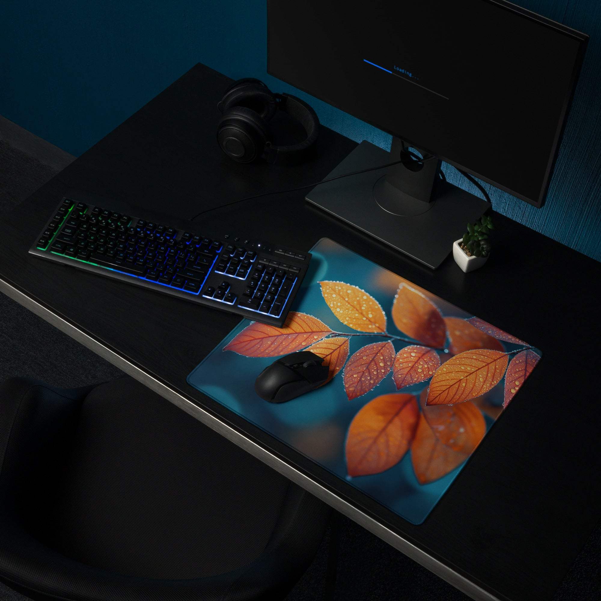 Large Autumn Leaves gaming mouse pad with orange-red design on teal, non-slip stitched edges