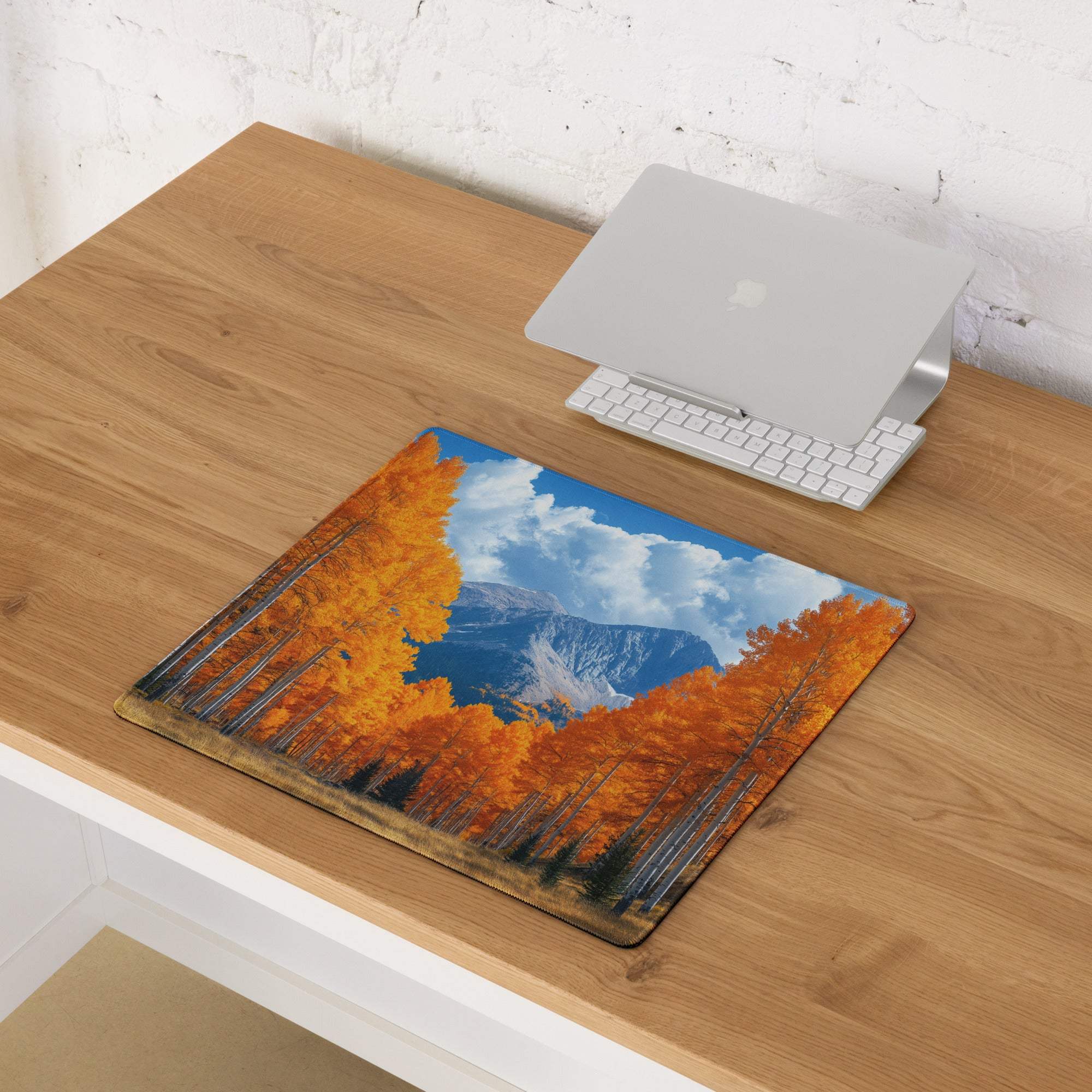 Large autumn forest orange gaming mouse pad with non-slip base and stitched edges