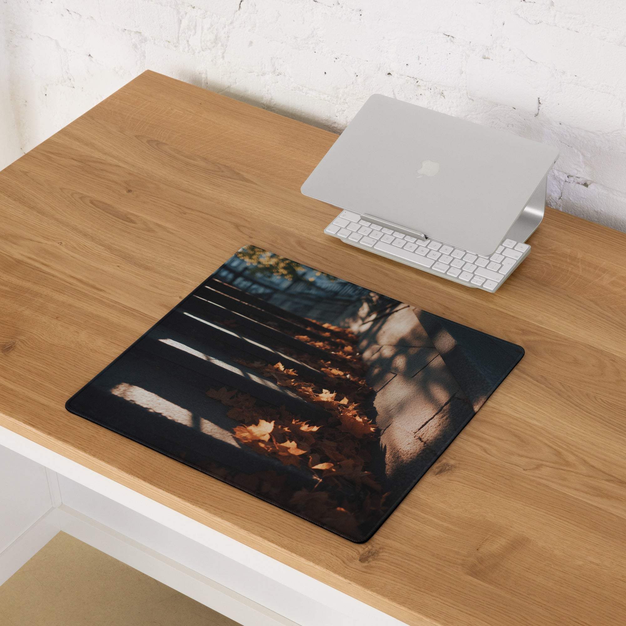 Black rectangular gaming mouse pad with autumn leaves and wooden planks