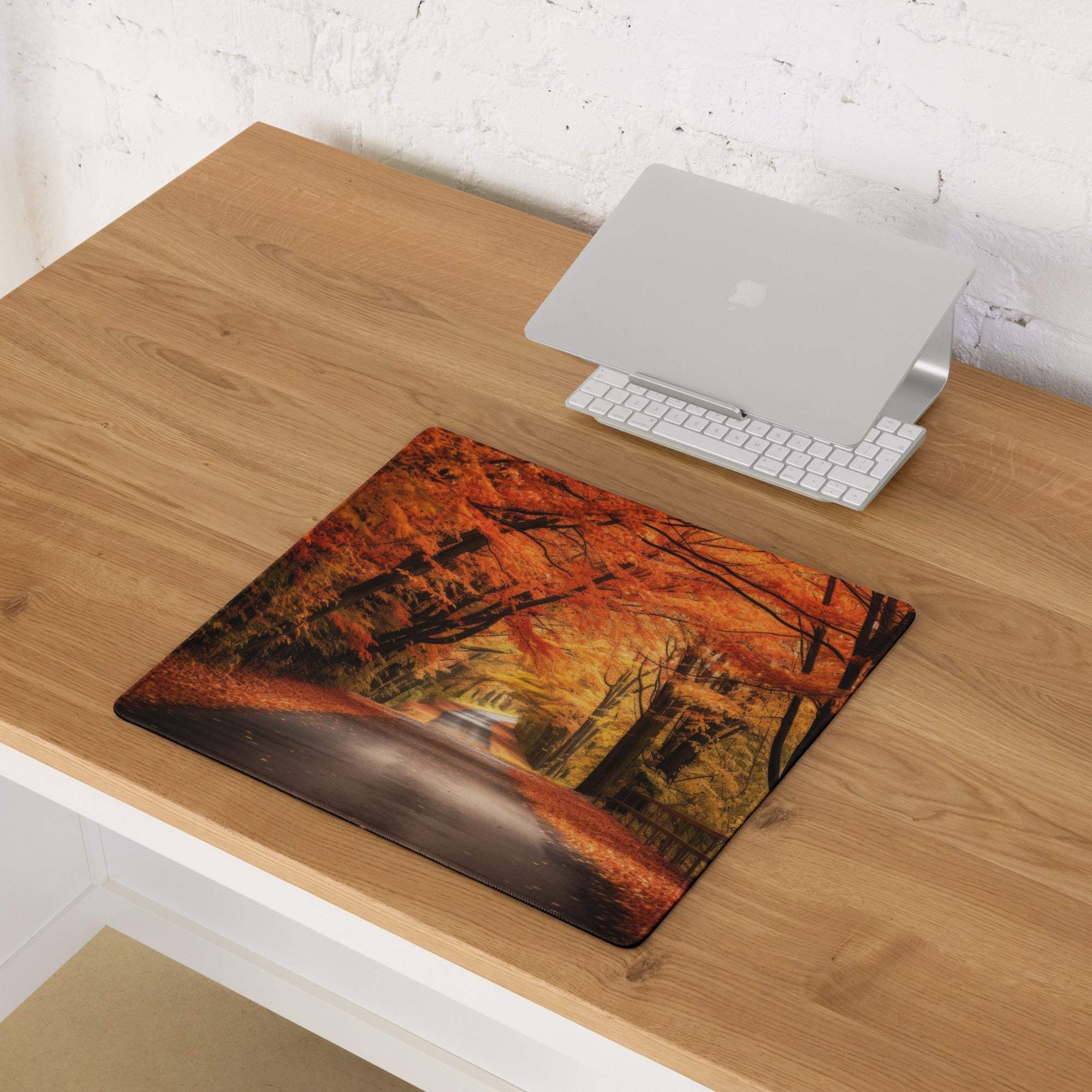 Large autumn forest mouse pad with orange leaves, non-slip base, edge stitching